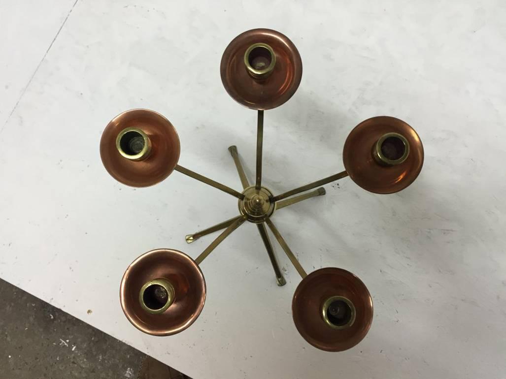 English W A S Benson, signed, An Arts & Crafts Brass and Copper Five Branch Candelabra