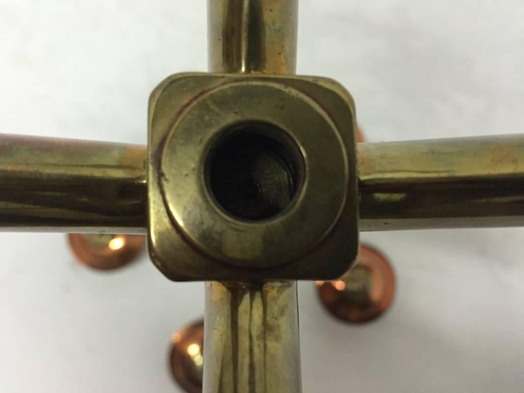 Arts and Crafts W A S Benson, signed, An Arts & Crafts Brass and Copper Five Branch Candelabra