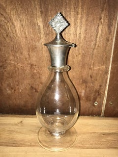 Greenwood and Watts. A Pair of Gothic Revival Silver Mounted Glass Decanters.