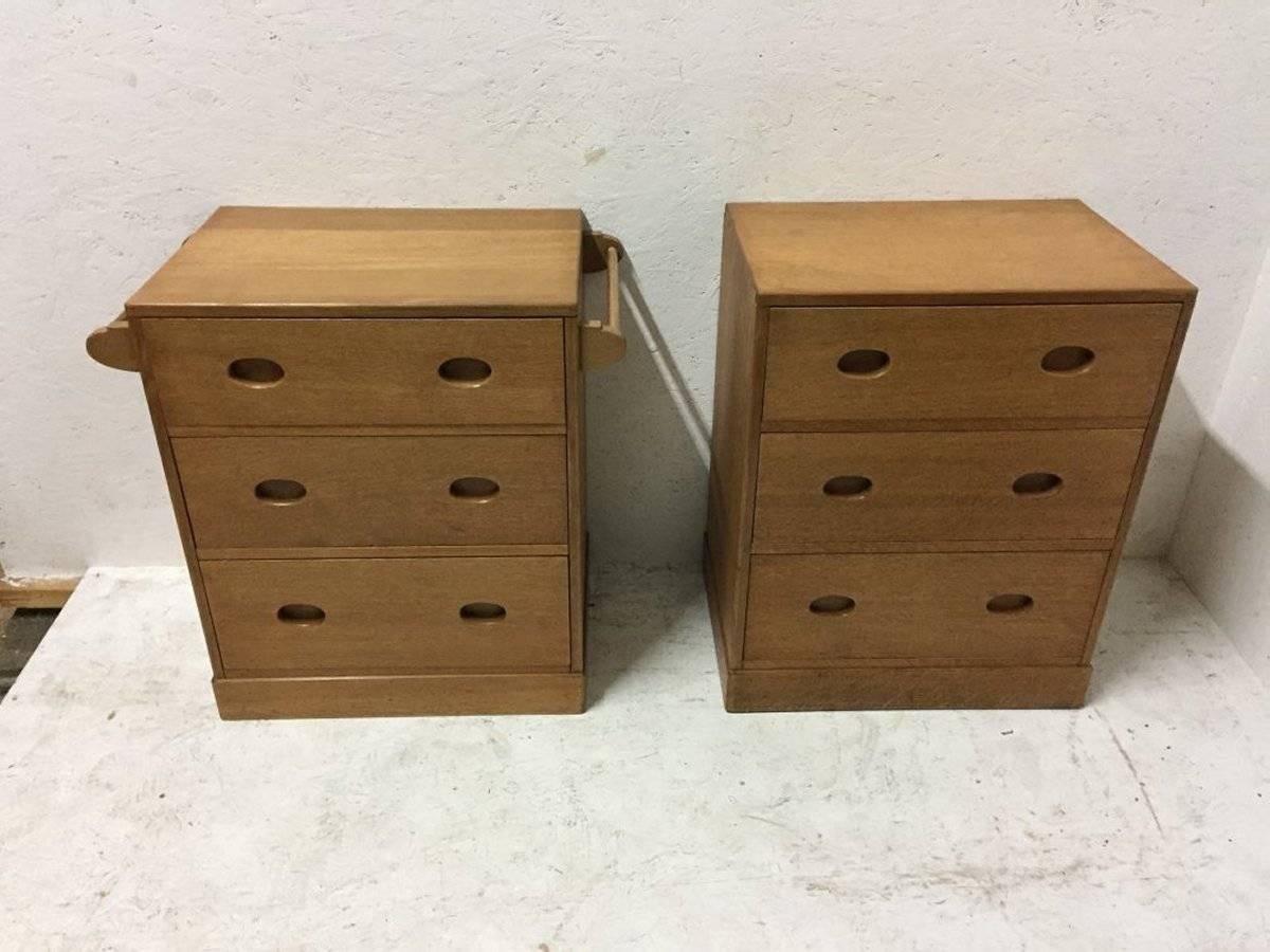 Ambrose heal. A super quality pair of petite Cotswold oak chests of drawers with cup handles with exposed dovetail construction to the top edges, one having hanging rails to the sides, a place to hang garments, ties, scarfs or towels.
 
