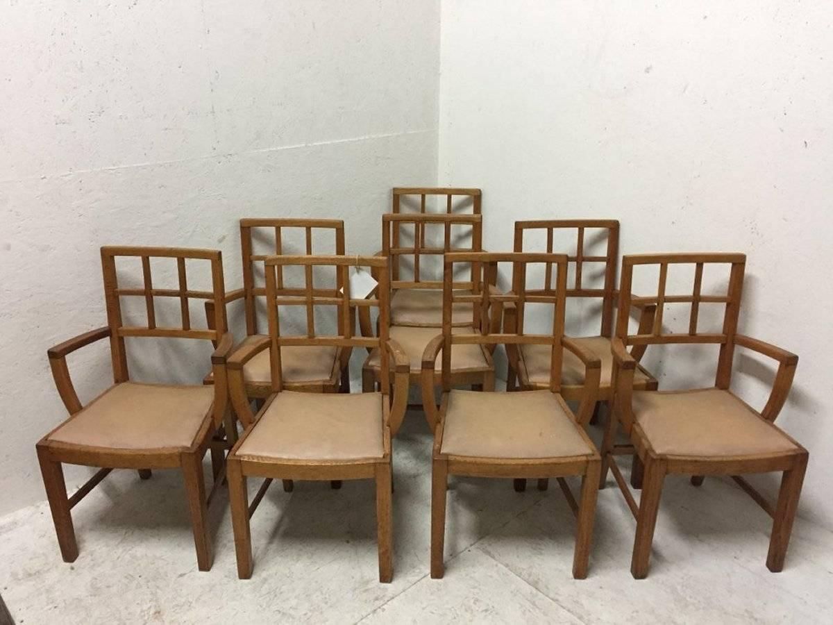 Heals of London Attributed, 
A set of 12 Lattice Back Oak Arts & Crafts Armchairs 
The arms are 25 inches from the ground and sit back a little further than usual allowing them to be pushed closer to a dining table or desk.
For sale individually or