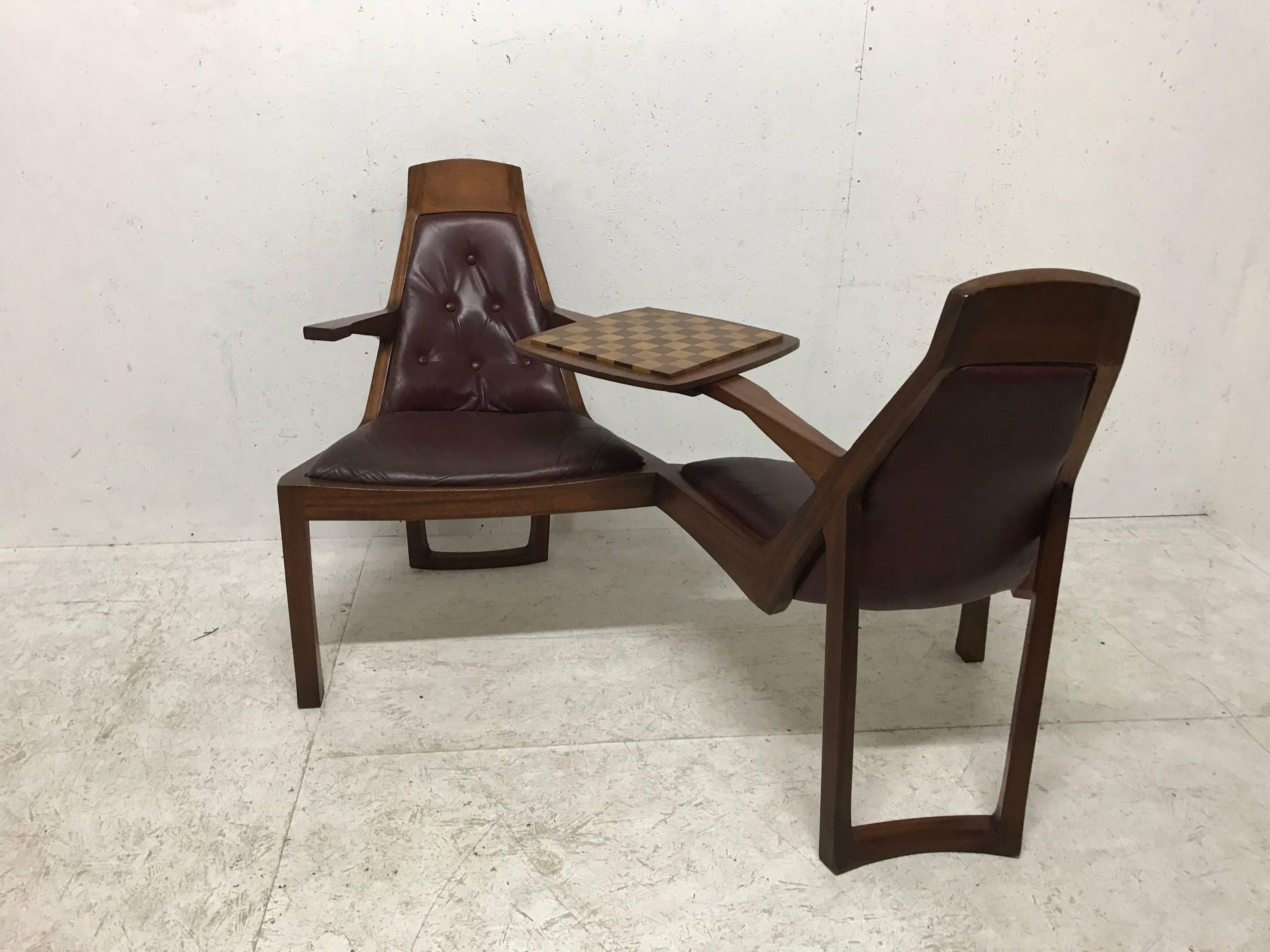 A superbly designed 'Danish style' teak duet seat for lovers of chess, this is a work of style, design, comfort and craftsmanship, it looks like it almost floats. There is a subtle organic feel about the whole composition. Beautifully hand made the