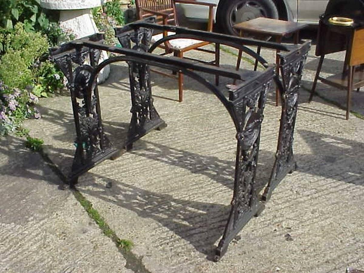 A beautiful pair of Aesthetic Movement cast iron garden tables in the manner of Thomas Jeckyll. 
Decorated with Swallows in flight within a roundel to each end and further stylized floral details throughout.
Measurements below are without a top.