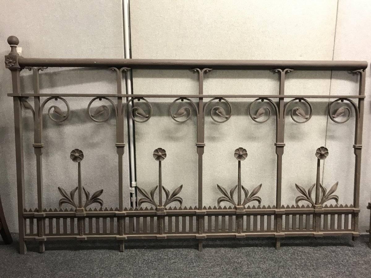 A stunning set of gothic or aesthetic cast iron railings or balconies in the style of Thomas Jeckyll with circular hand rails and stylised Sunflowers and leaf details.
There are two identical longer lengths with ball finials and a smaller piece