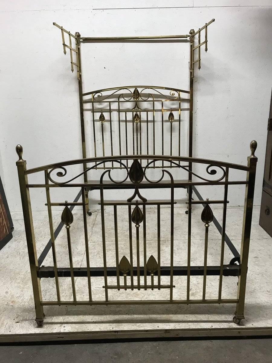 Arts and Crafts An Arts & Crafts Cast Brass Half Tester Double Bed with Stylised Floral Details