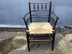 William Morris, A Classic Arts & Crafts Ebonised Armchair from the Sussex Range.