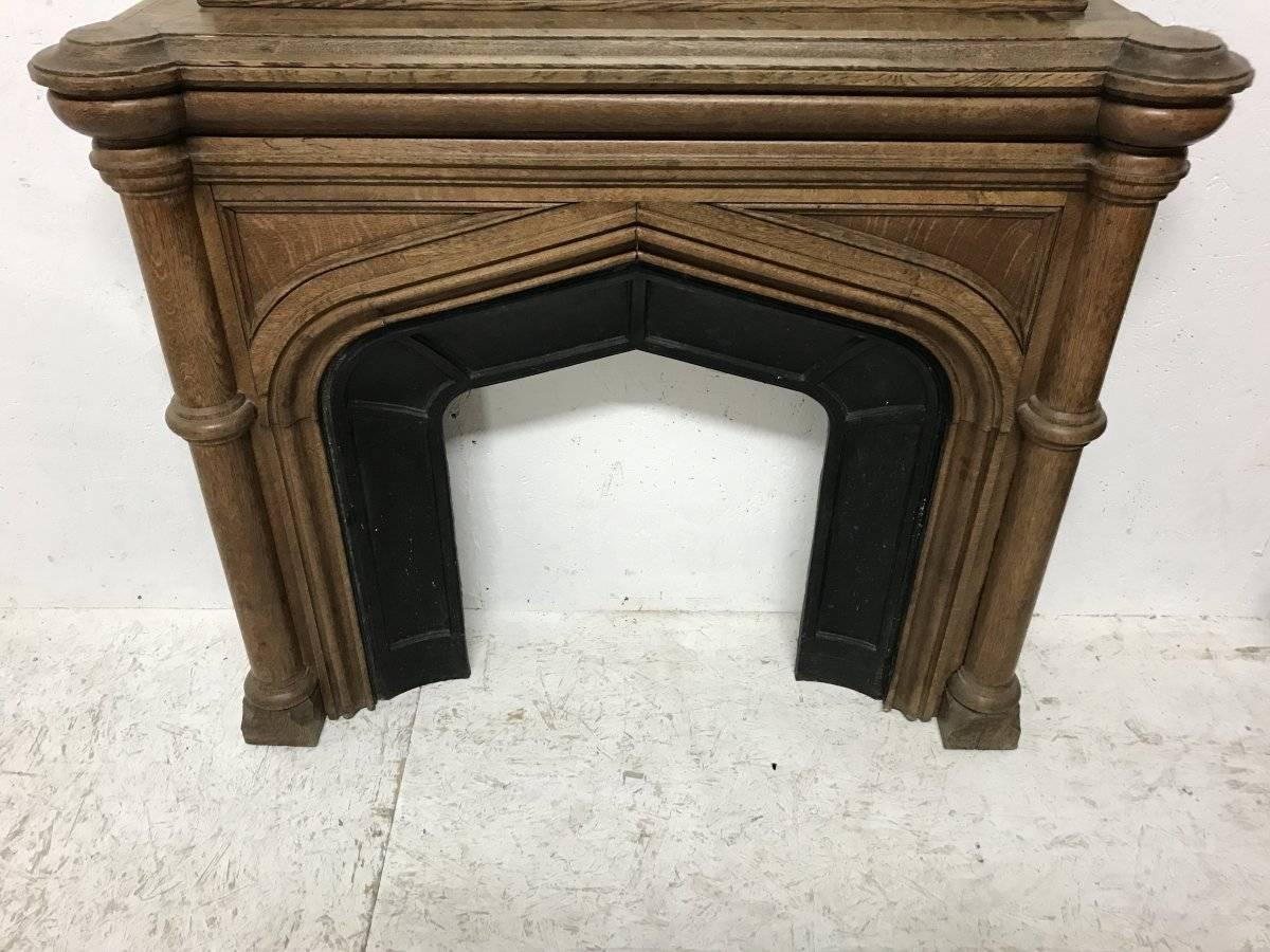 Hand-Crafted Gothic French Oak Fireplace with Original Overmantel Mirror and Turned Pillars
