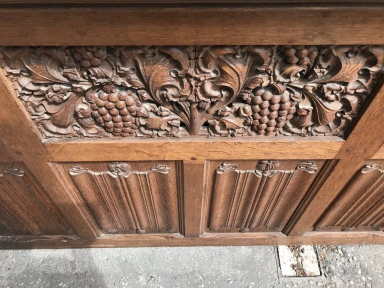 Arts and Crafts Oak Panelling with Hand Carved Pomegranates, Roses and