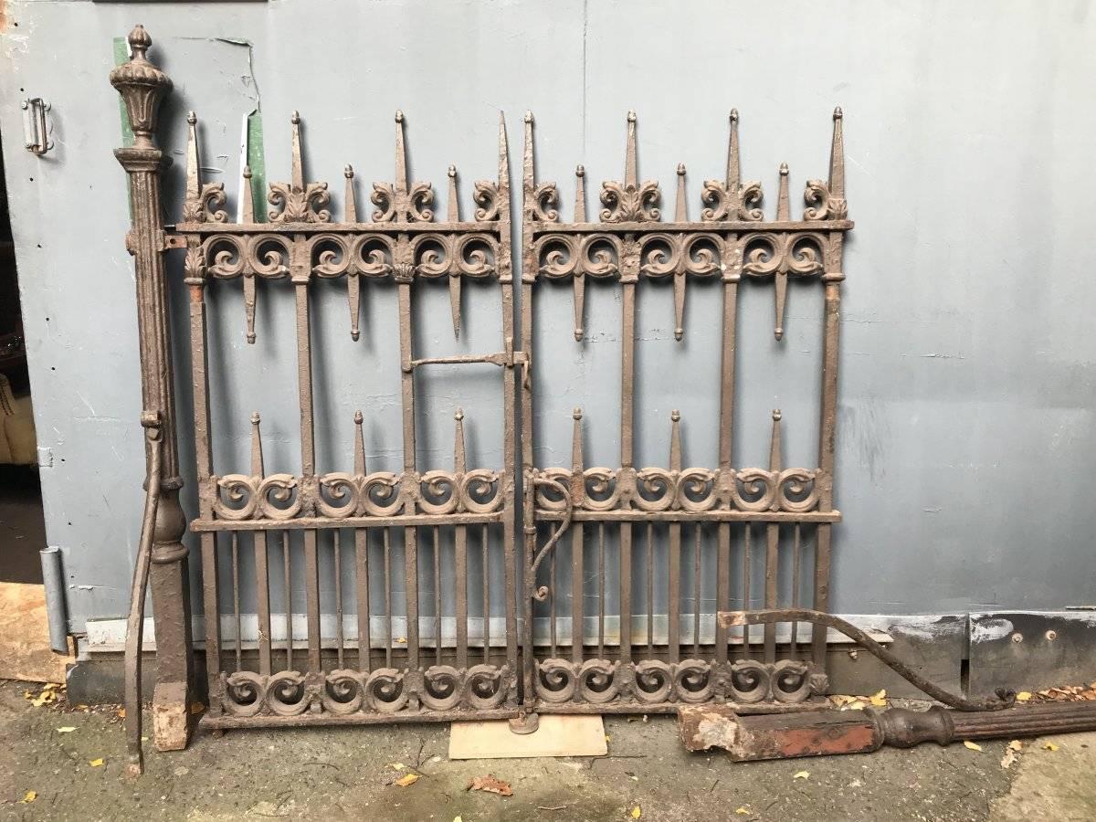 A pair of Gothic Revival cast Iron gates with acorn finials and scroll work castings. To include the original reeded upright posts and their side stays, (one shown laying down).
Measurements of the actual gates to the acorn finials are:- 52.5