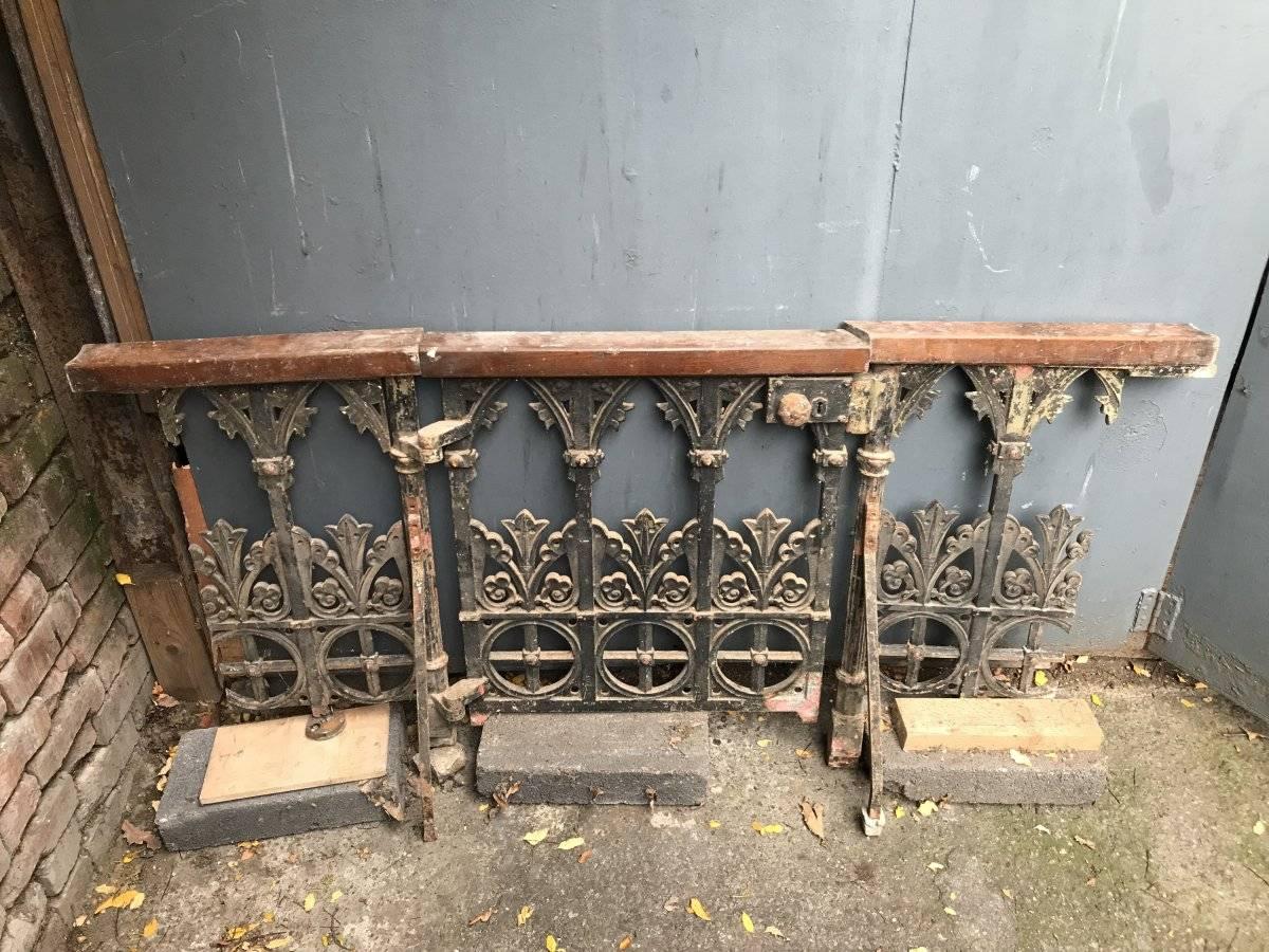A Gothic Revival cast iron gate with both side railings in the style of Dr C Dresser with all-over Geometric decoration. Retaining the oak hand rails and the original pair of wall side stays and supports to fix them in place.
