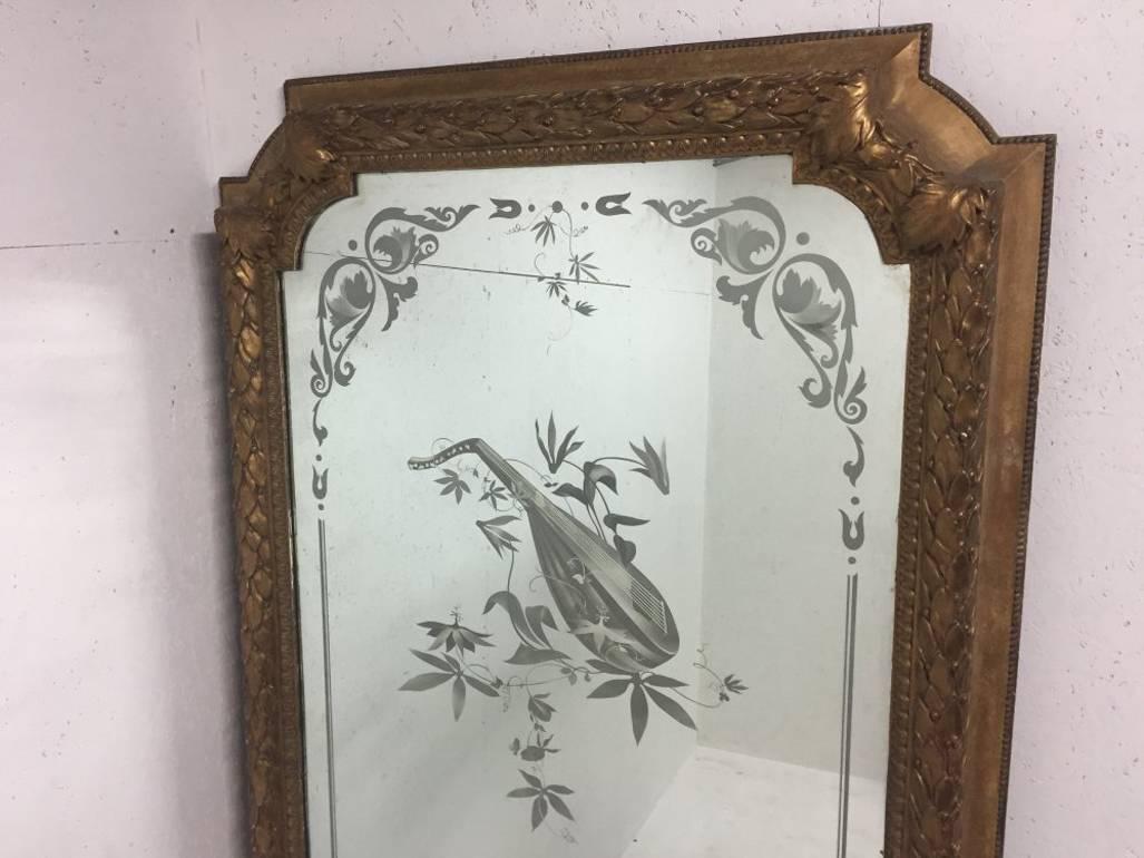  A magnificent 8’ 6” tall mirror from The Royal Albert Hall with gilt Laurel decoration and etched details of a Mandolin with trailing leaves finishing and the initials RAH to the mirror plates. The mirrors are made up of a composite mix with