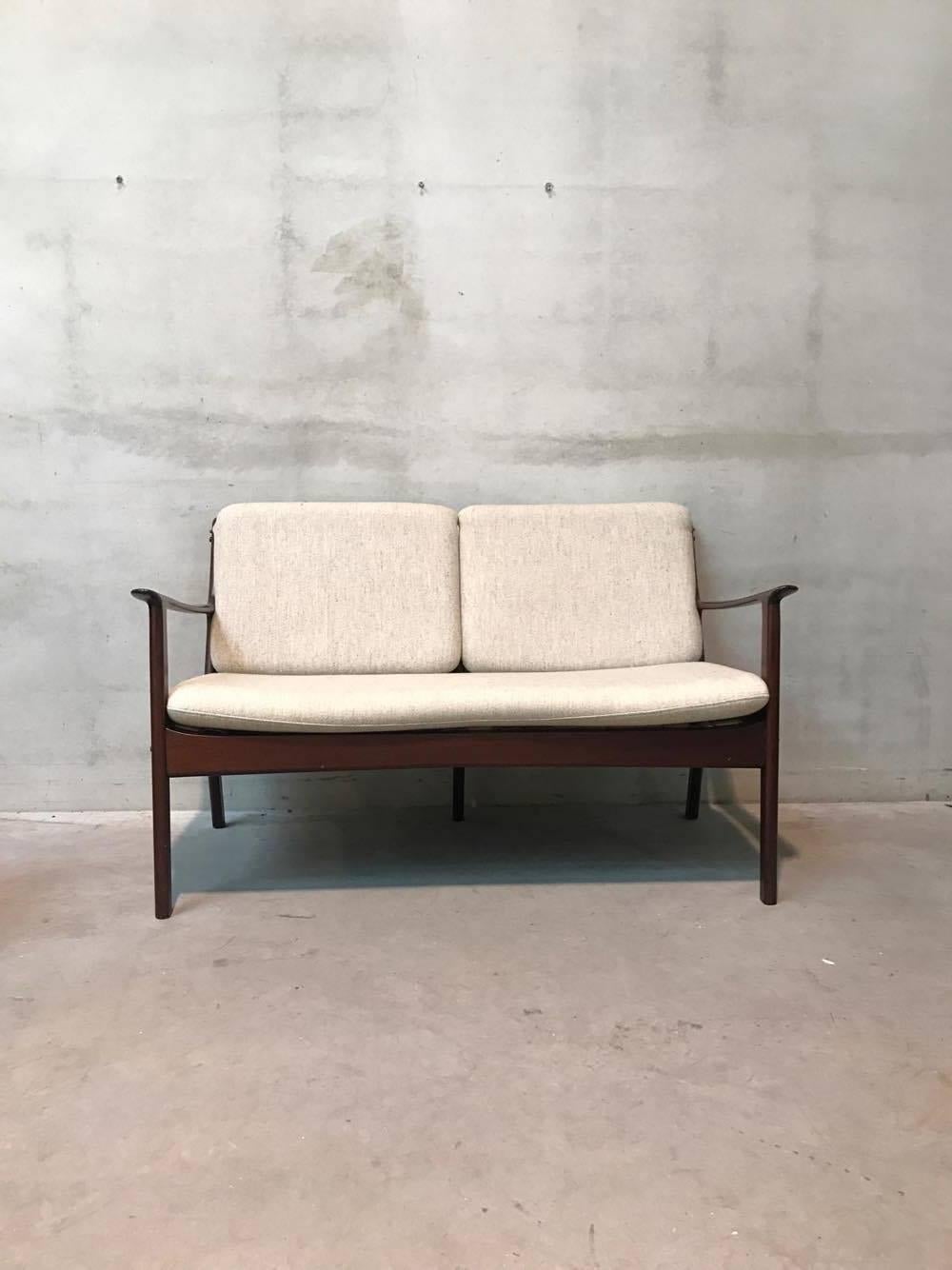 This senator two-seat teak sofa was designed during the 1960s by Ole Wanscher for P. Jeppesens möbelfabrik in Denmark.