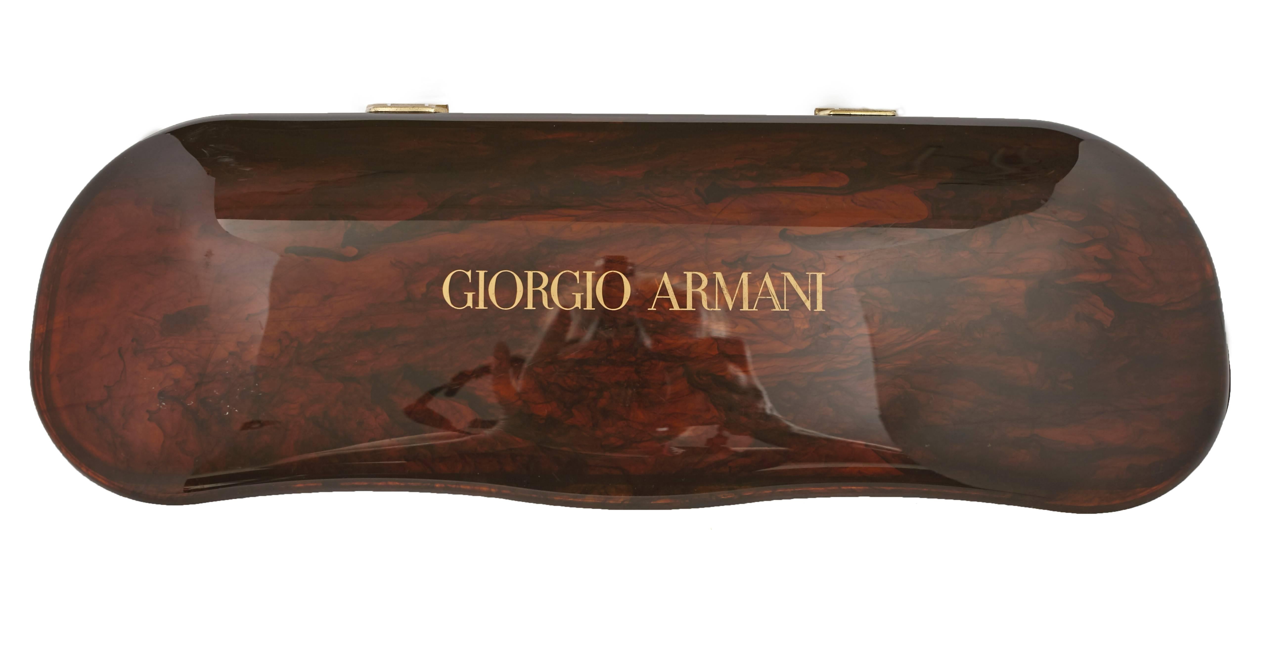 Giorgio Armani wire rimmed glasses in faux tortoise shell case. Probably used as store display. Very fun conversation piece. When open, case is supported by built in stand and is 9.5 inches high.