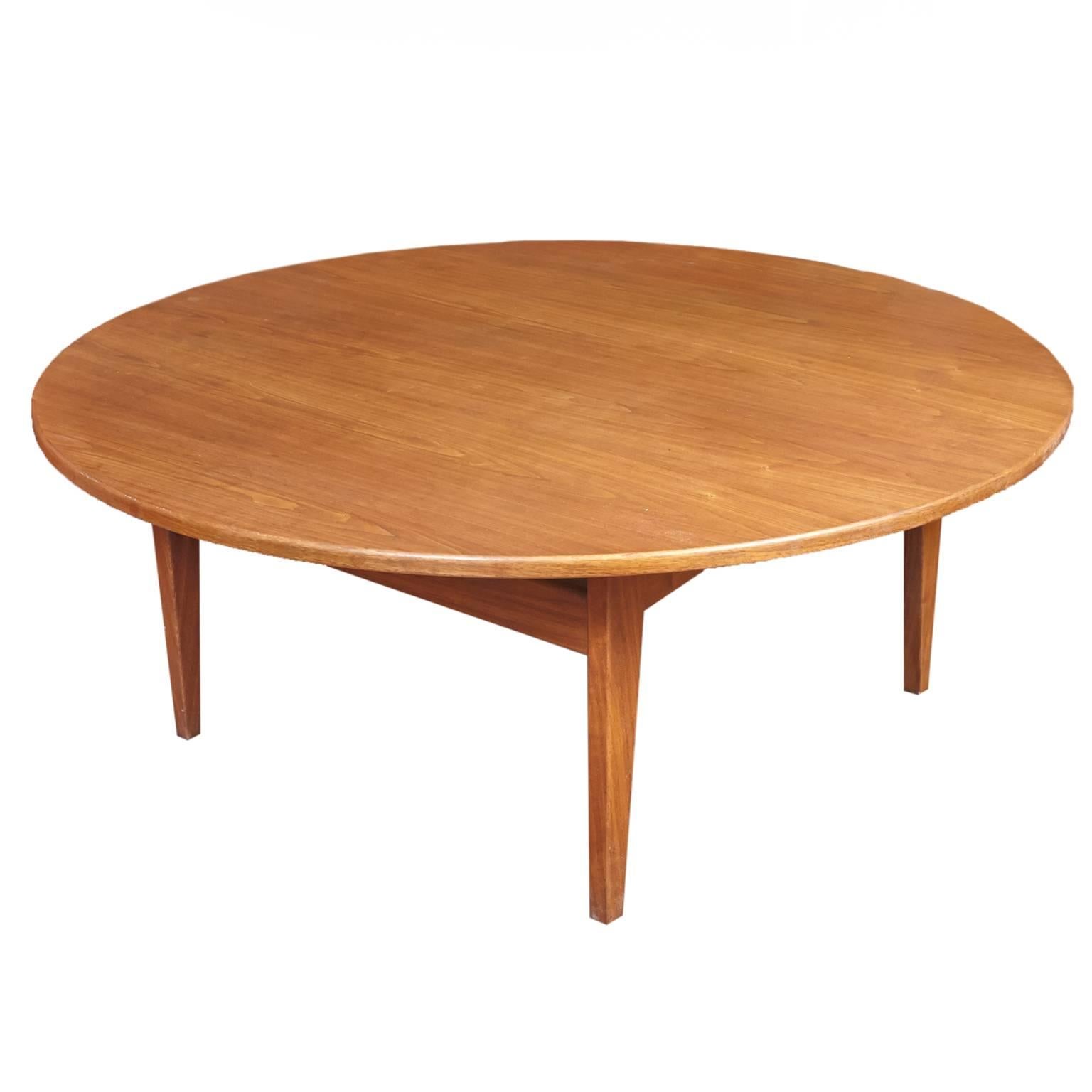 Beautifully designed Jens Risom floating coffee Table. Round top with square sculptural Base. Original Jens Risom Design Inc. label on bottom.
 
