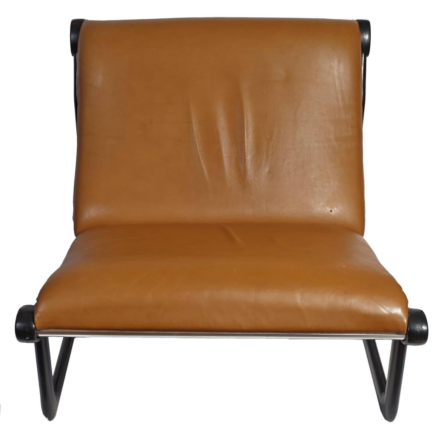 Carmel colored faux leather sling chair by Bruce Hannah and Andrew Morrison for Knoll.
Black powder coated base over aluminium.