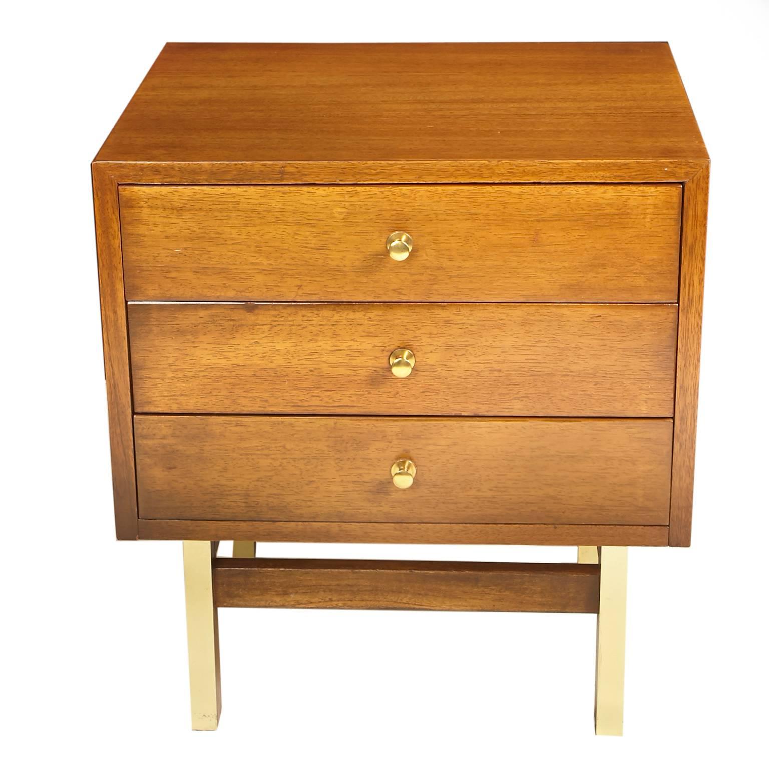 Beautiful American of Martinsville nightstand or side table. Three drawers with original brass pulls, brass clad legs. Stamped American of Martinsville inside one drawer. Very good vintage condition with minor scratch on side.
