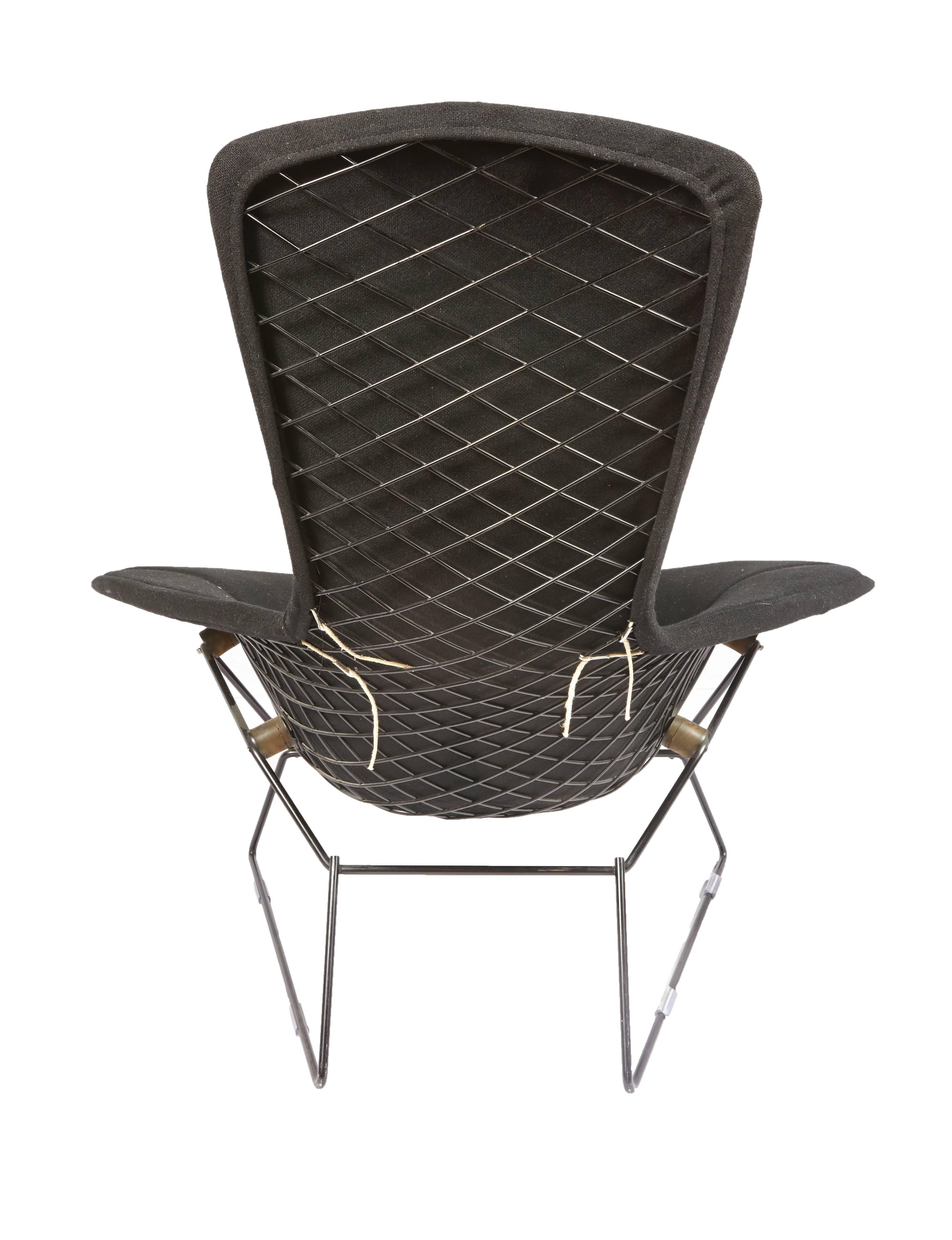 Vintage Bertoia bird chair and ottoman with full cover in Classic black bouclé for Knoll.
    