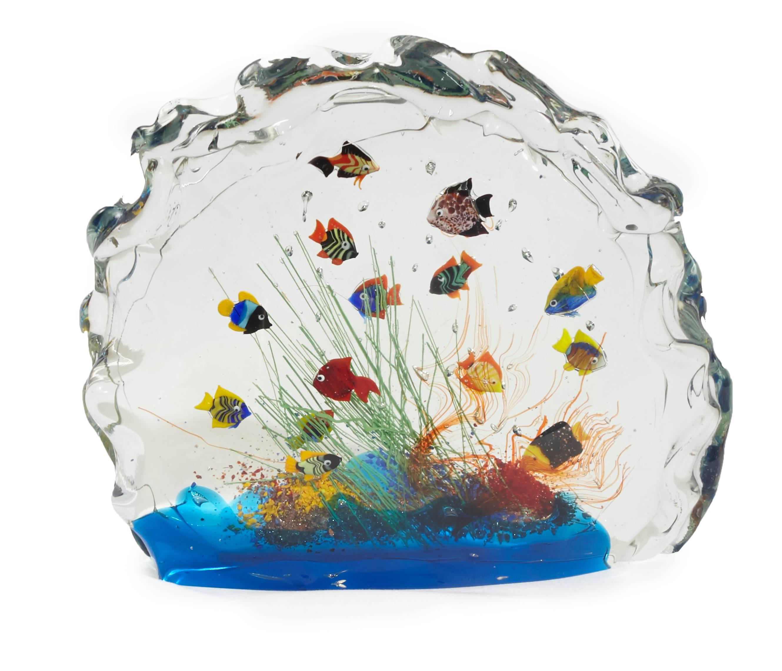 Handmade Murano glass aquarium holds 13 colorful fish, with undersea plant life. A statement piece that will enhance any decor.