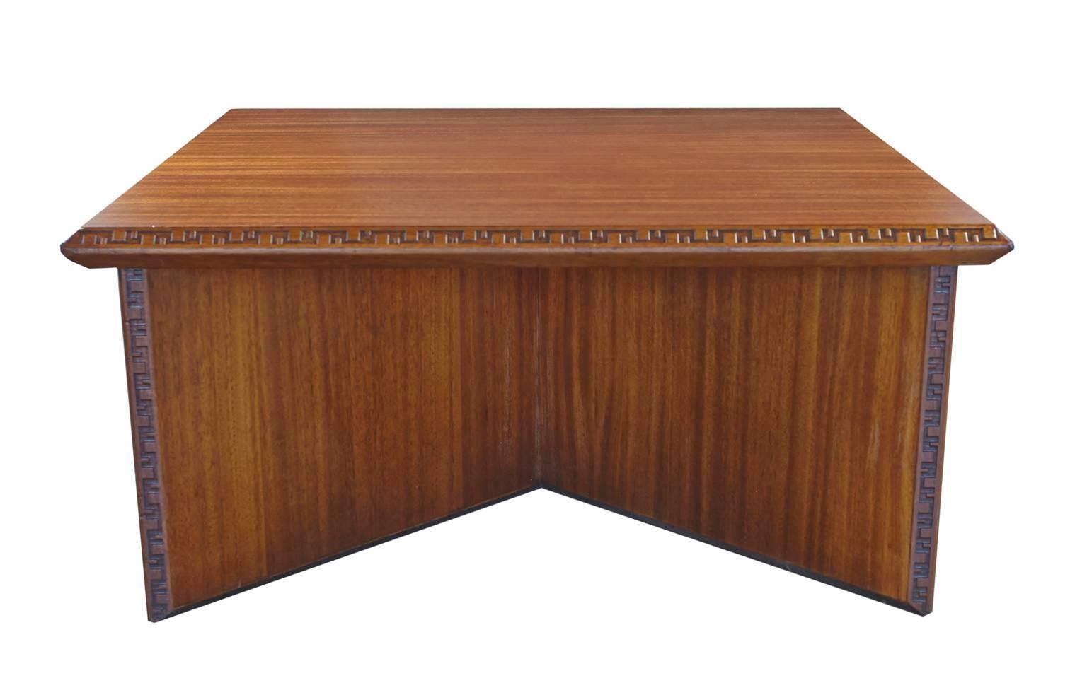 Mahogany coffee table designed by Frank Lloyd Wright for Heritage Henredon,
from the Taliesin collection. This beautiful table is signed Frank Lloyd Wright
Heritage Henredon on the bottom. 
 