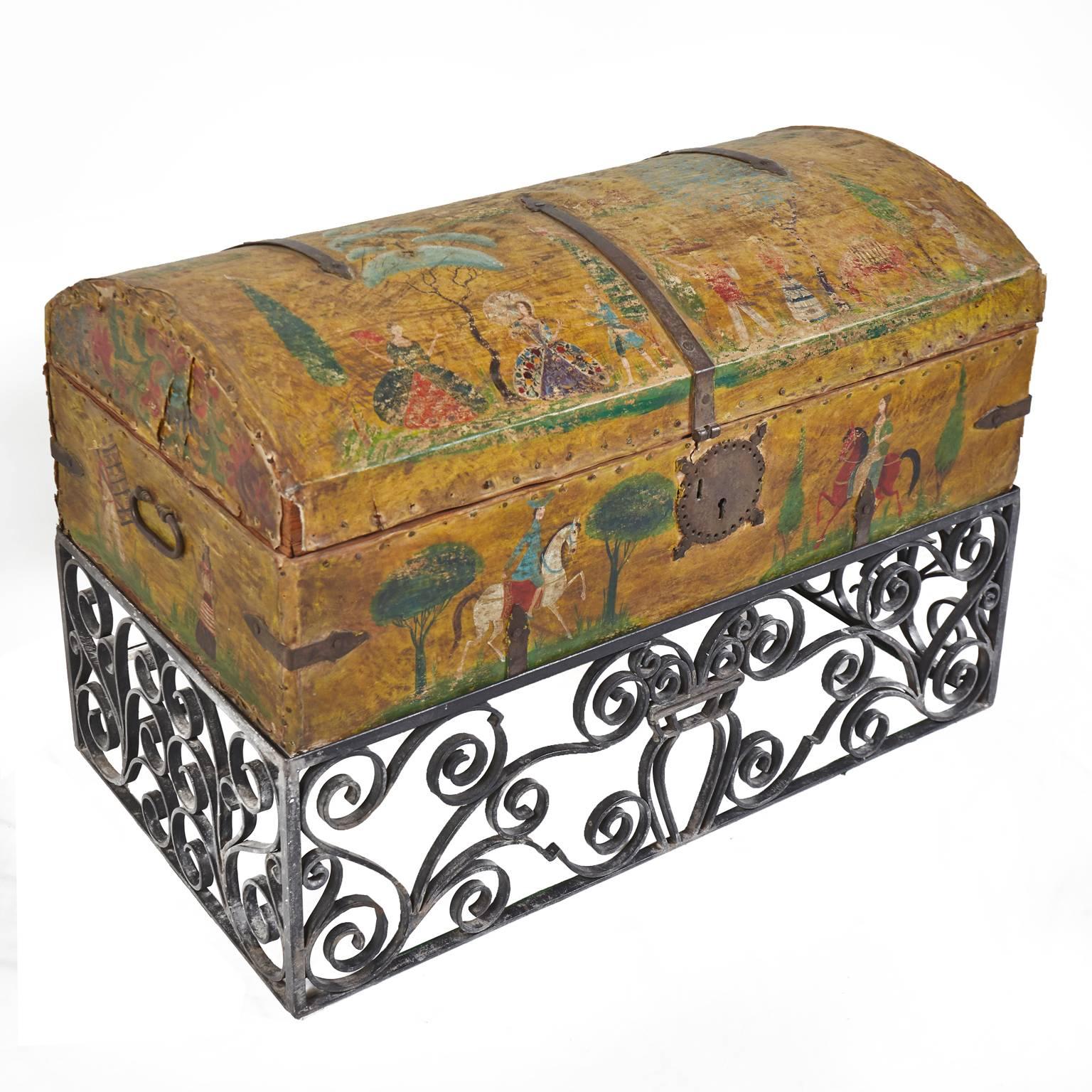 Wonderful weathered hand-painted leather trunk with wrought Iron stand by Mexican Artist Salvador Corona. This trunk was on a ranch in Tucson, AZ.
and was exposed to the elements. The trunk has character and patina. Salvador Corona was born in 1895