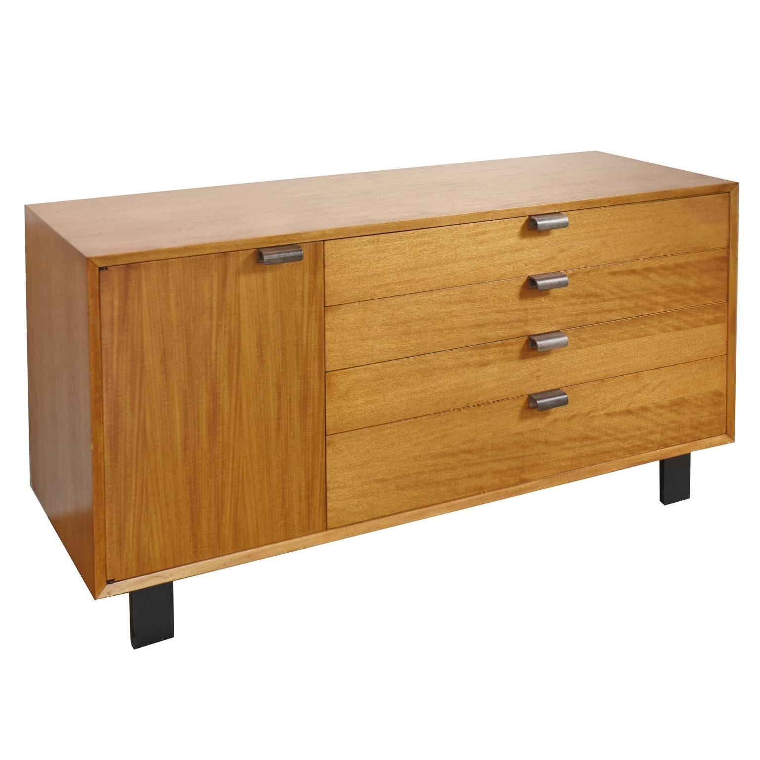 George Nelson for Herman Miller Primavera four-drawer dresser, credenza or cabinet
Four drawers with metal pulls, two divided drawers, and left side cabinet with two shelves, black ebonized feet. Foil Herman Miller label in top right drawer.