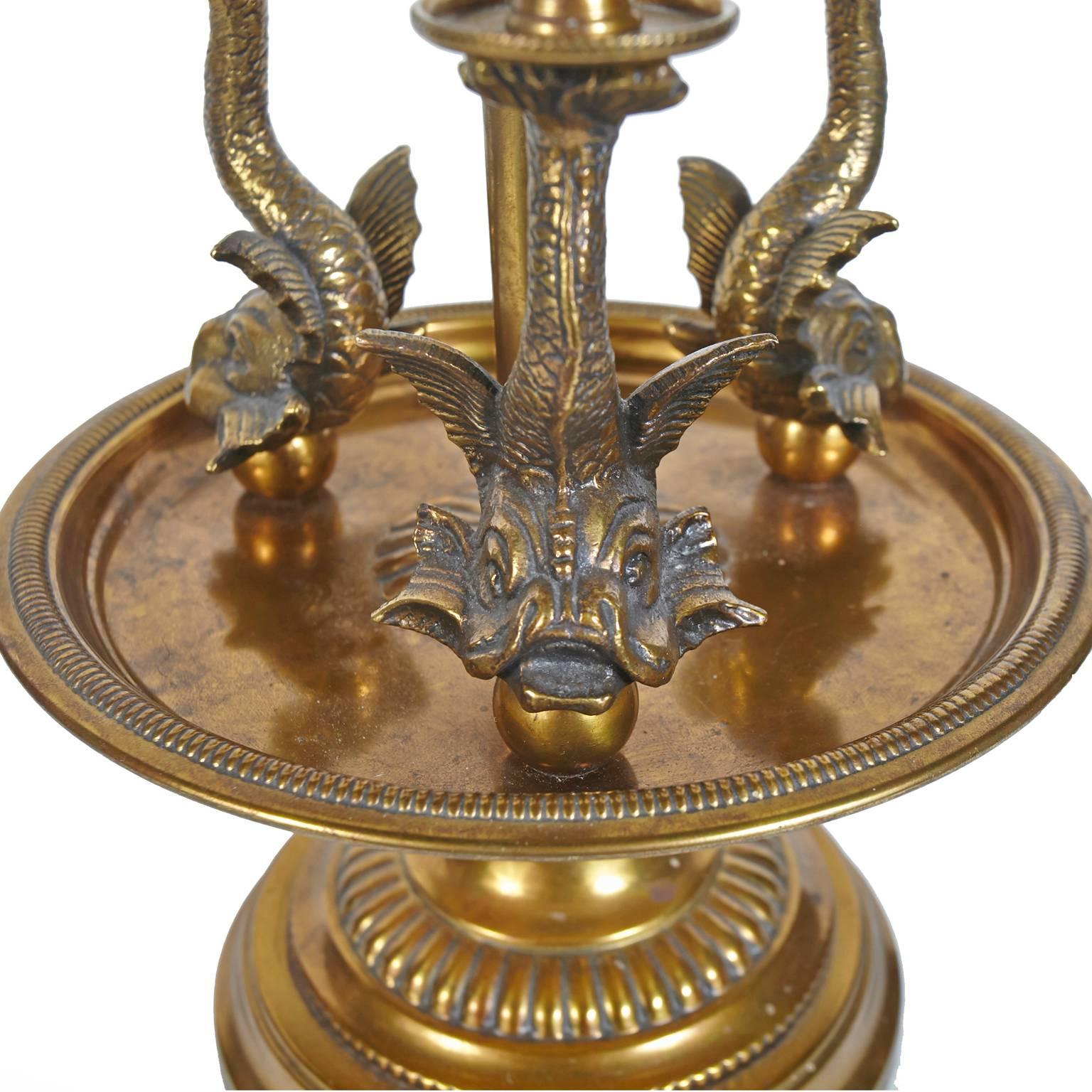 Unique brass Paul Hanson three dolphin table lamp.
Original white shade with brass colored trim.
 