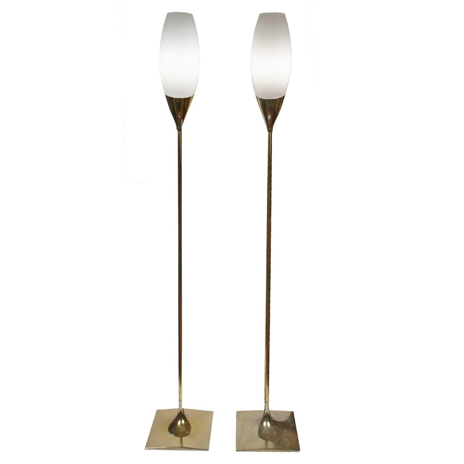Pair of brass with frosted glass globes, laurel tulip floor lamps.