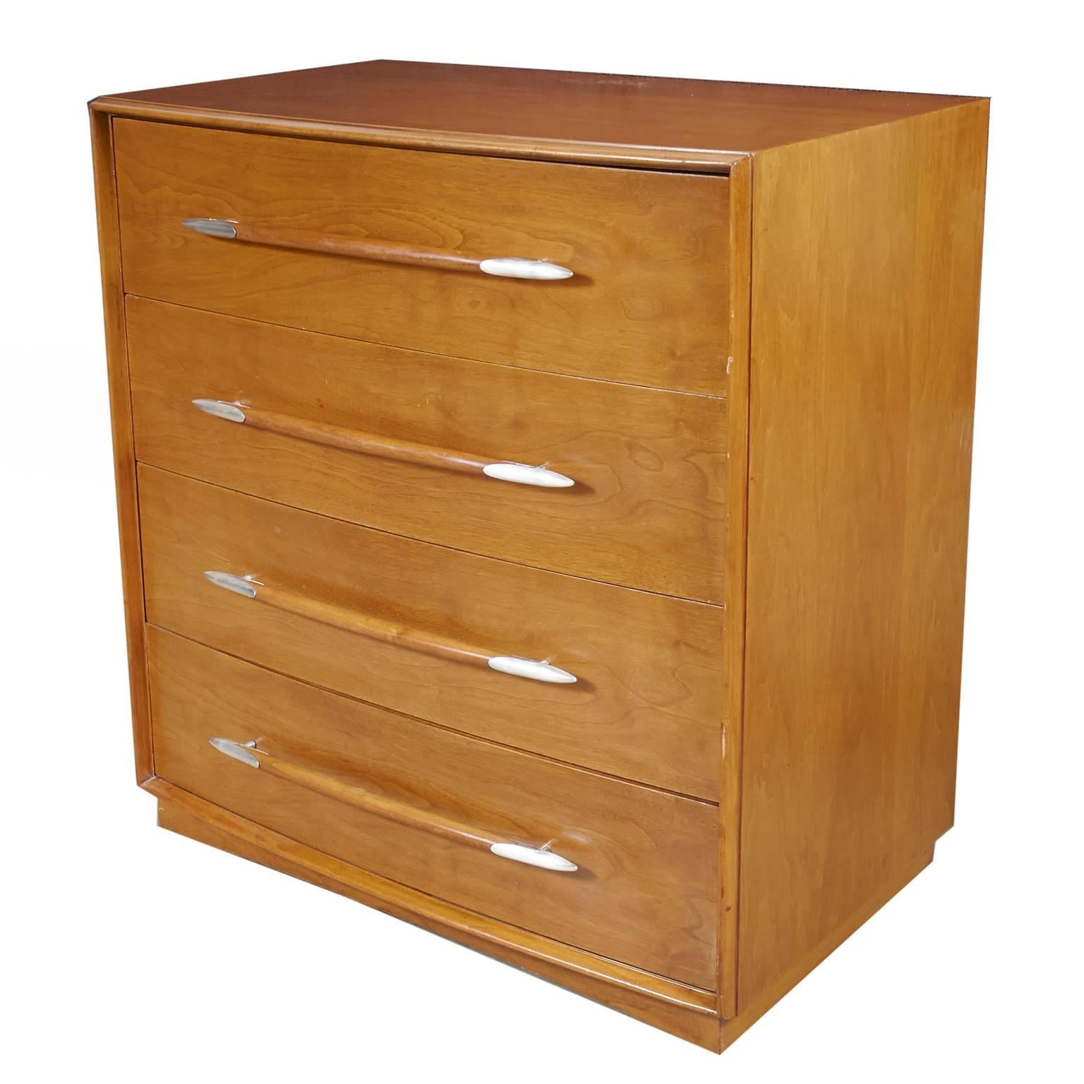 T.H. Robsjohn-Gibbings chest of drawers for Widdicomb four-drawer dresser.
Lightly refinished walnut retaining original patina and color. Hardware pulls have silver plated tips.