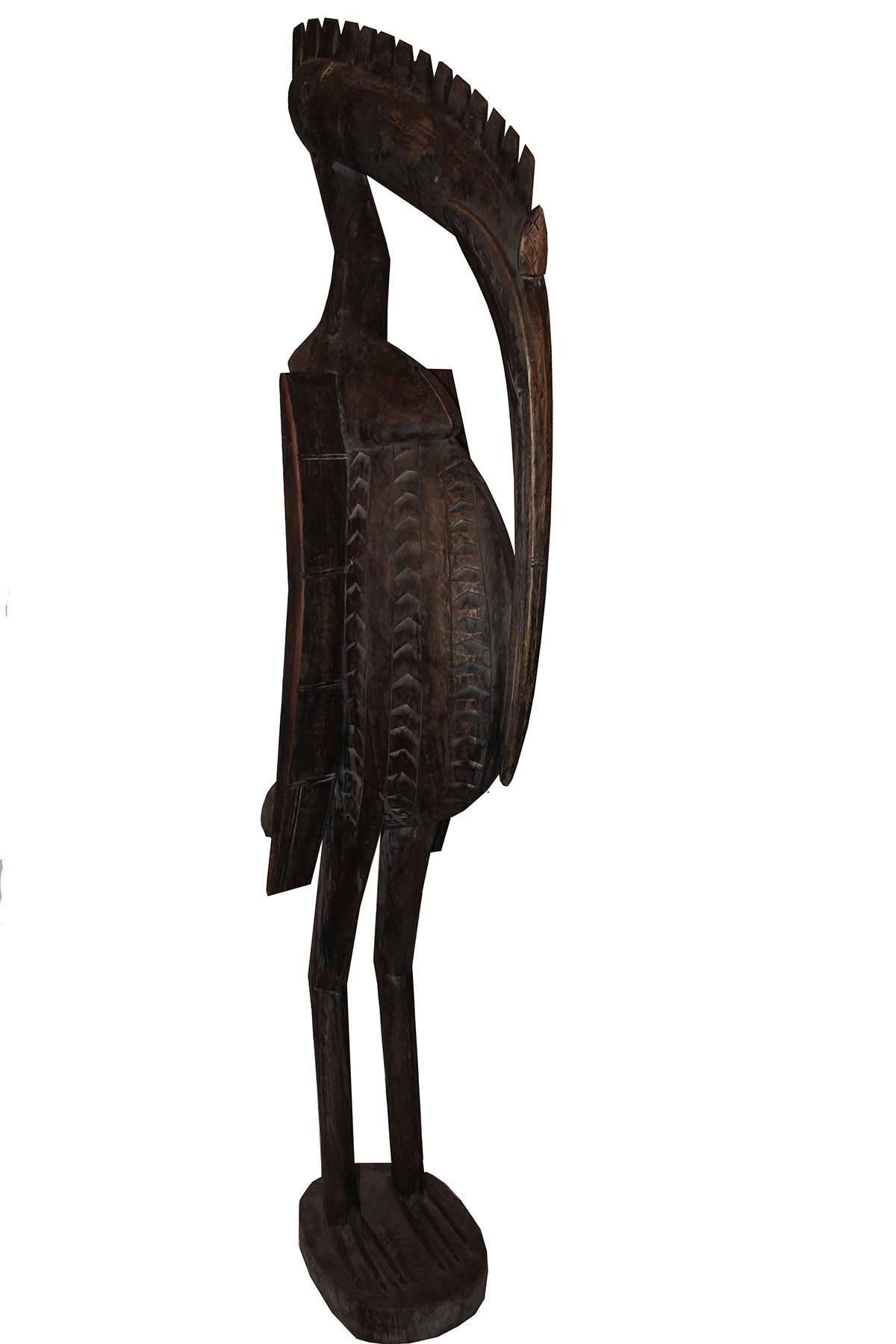 Standing over 5 foot 3 inches this is a unique piece. The Senufo people of West Africa call these statues porpianong, referring to the hornbill as the “master among the birds.” Hornbills mate for life and share equally in the raising of their young