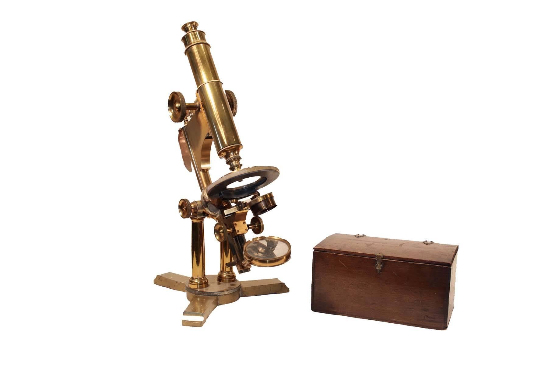 Bausch & Lomb microscope with original box of lenses. Nine extra sets of lenses are in brass containers in the original box, This solid brass microscope is in amazing condition considering age. Optics are all in working order as is all adjusting