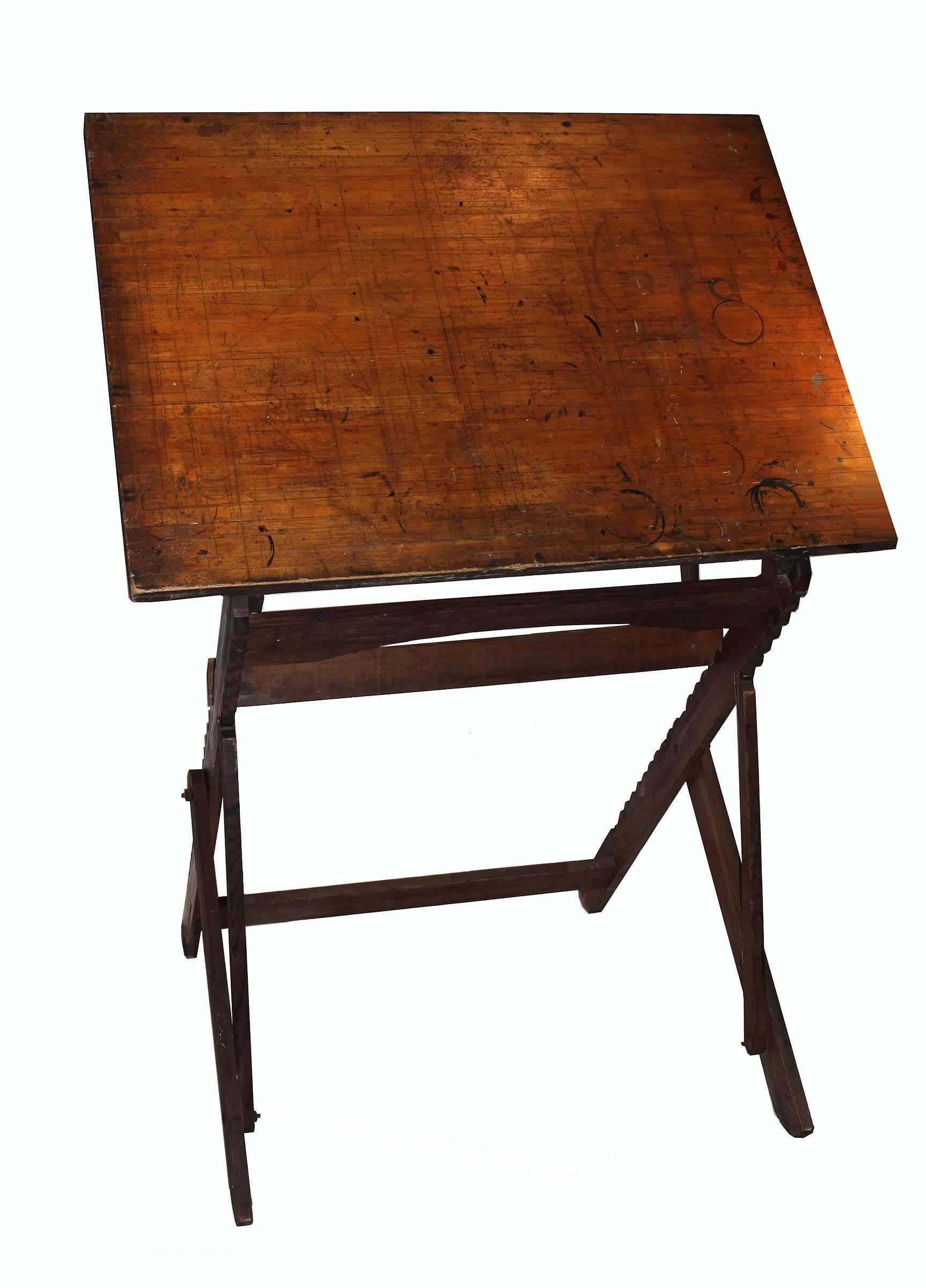 A beautiful early drafting table. A unique design with many configurations. Solid wood with iron bolts and fasteners its construction has stood the test of time. As useful today as when it was constructed this would make a unique standing desk or an