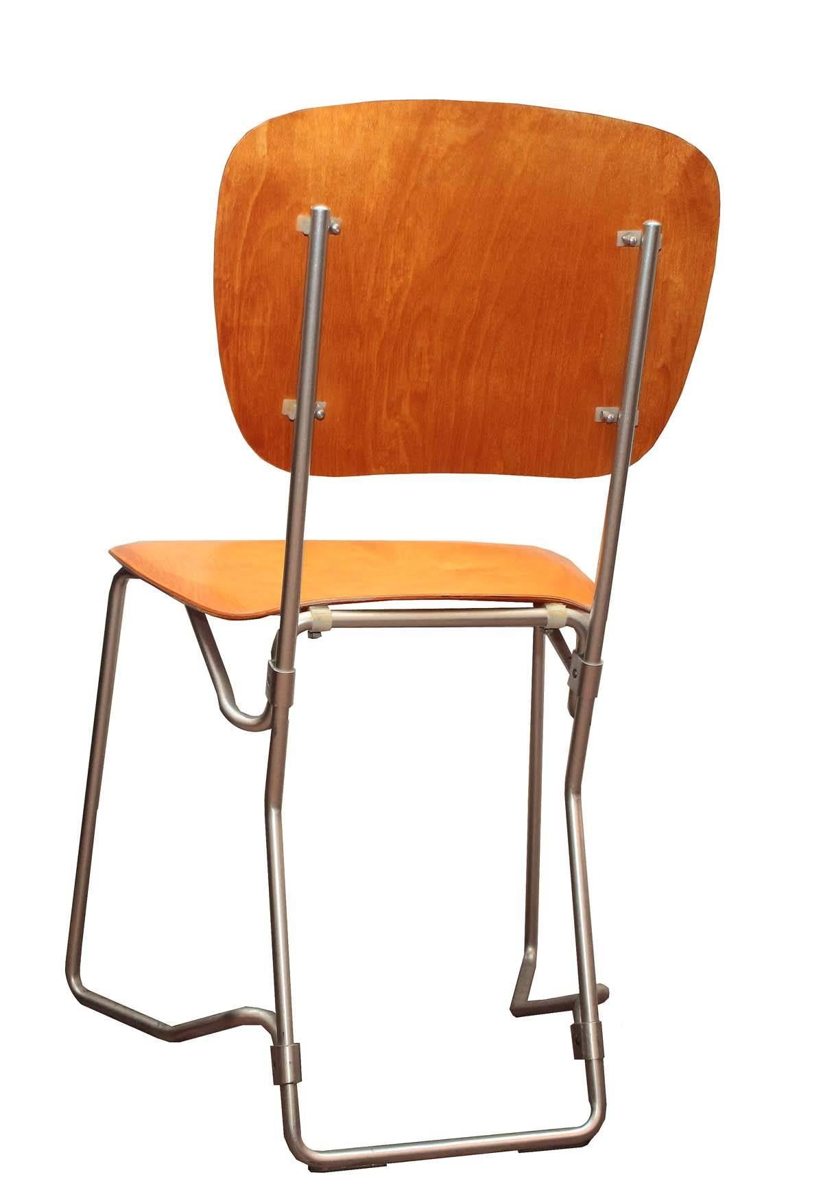 Set of original Armin Wirth folding chairs. Great condition aluminium frame with wood seats. All fold with ease and stack as designed. A sexy design that are both fantastic to look at and comfortable to sit on. Seat height: 17