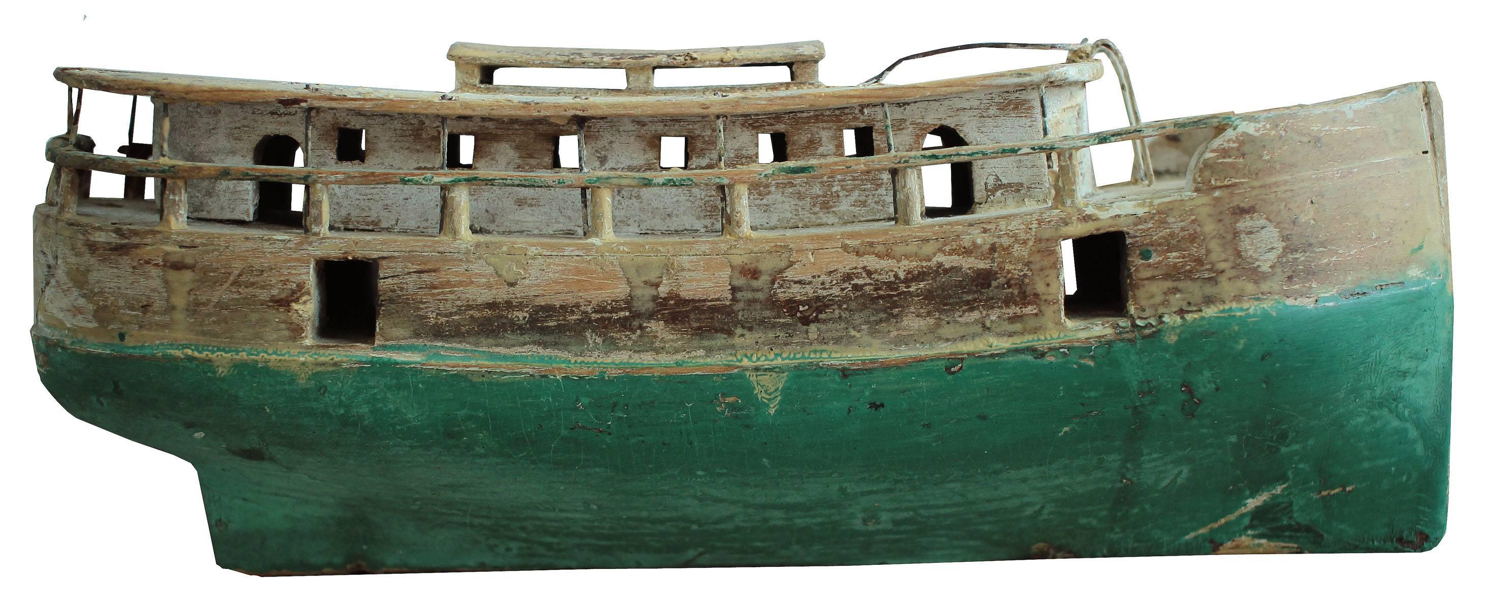 A detailed boat model, original finish, wire rails and amazing details throughout. Each deck is hand-carved with port windows and doors and wire ladders and uprights. The finish is fantastic with bleached out whites and greens.