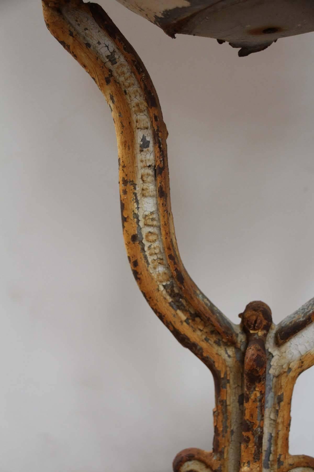 This antique metal buoy is sitting unattached on a metal stand. The wear is great and condition gives it a wonderful look. Great nautical decor it has a sculpted look but is a nice practical nautical buoy.