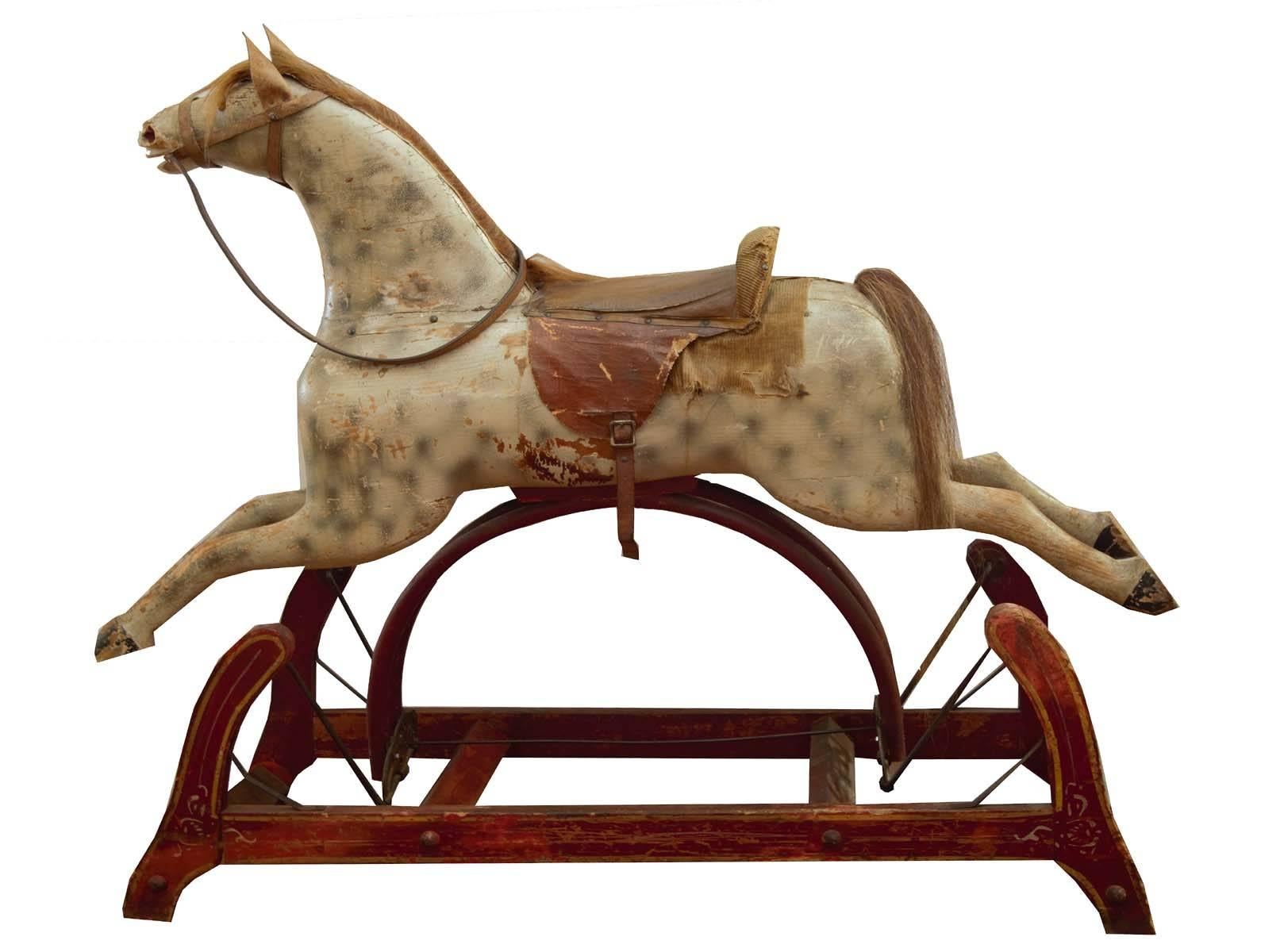 Early rocking horse, solid carved wood and original horse hair mane and tail. beautiful patina and a classic Americana style and look.