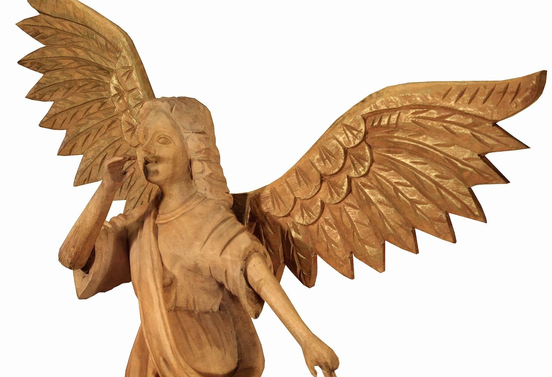 This is an large architectural element salvaged from a North American Church. Hand-carved with amazing details. The wings are detachable for shipping and easily slide onto her back. The wood is solid maple there are remnants of gold guild on the