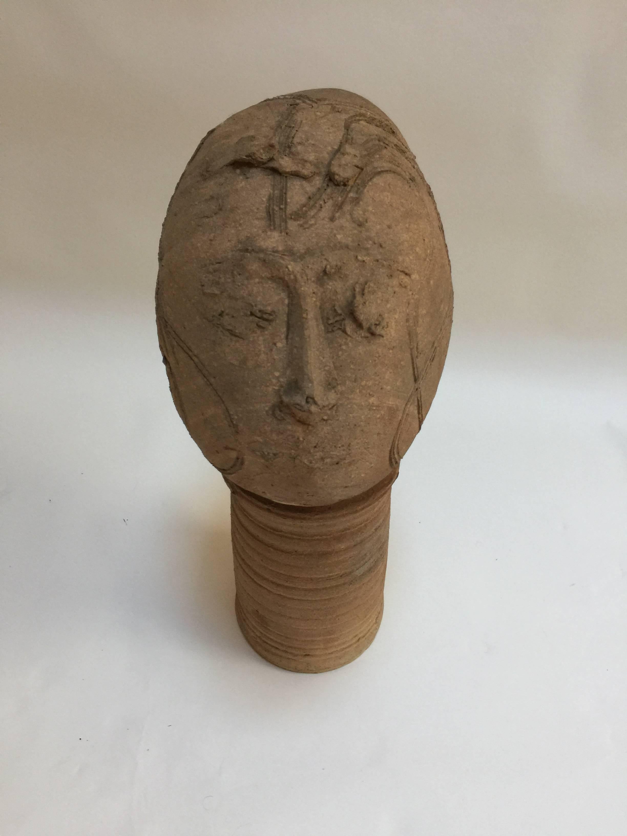 This 1950s pottery head sculpture came out of a professor's estate in Florida. No signature found. In fine condition. 20