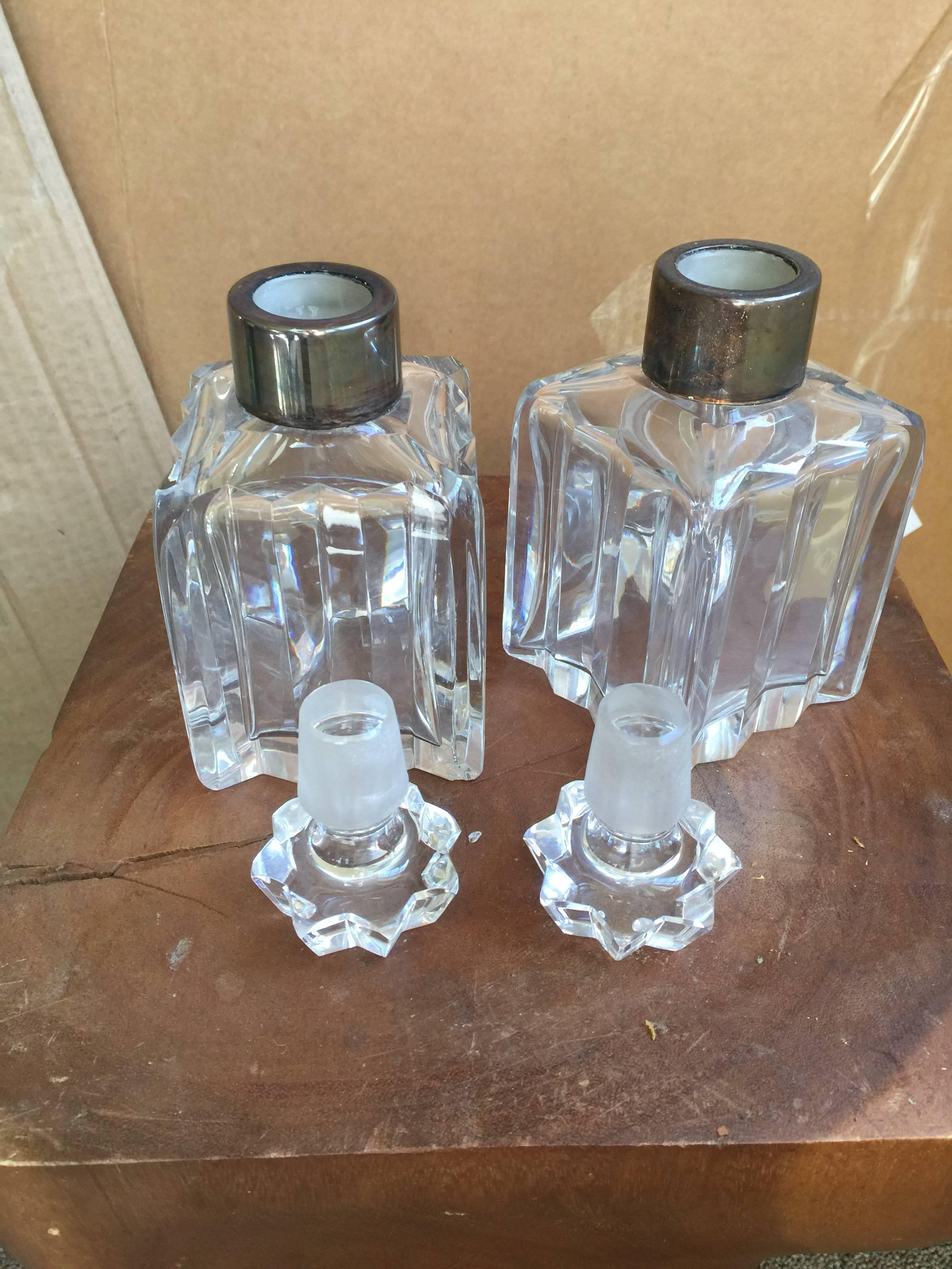 The decanter collars on marked West Germany. Heavy and thick crystal. In fine condition.