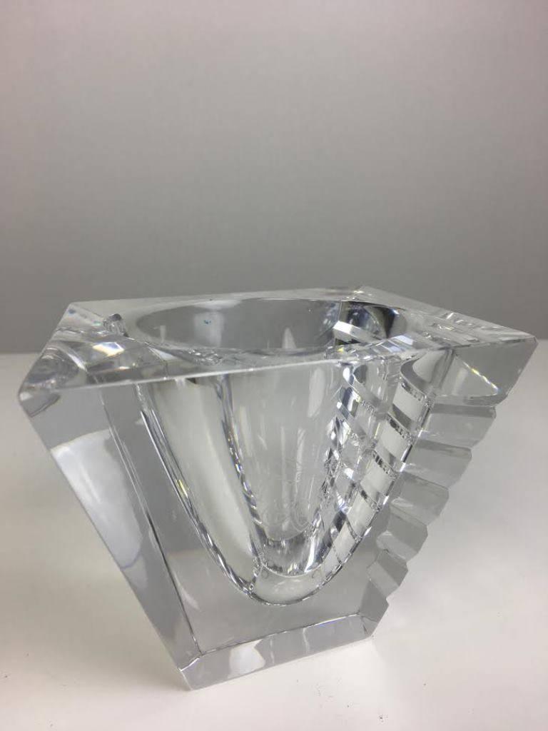 Signed, numbered and bearing the initials JJ along with a serial number. Circle and square unite to create dramatic decor. This luxe crystal vase has horizontal cuts that play with light. Eagle crest. 
 