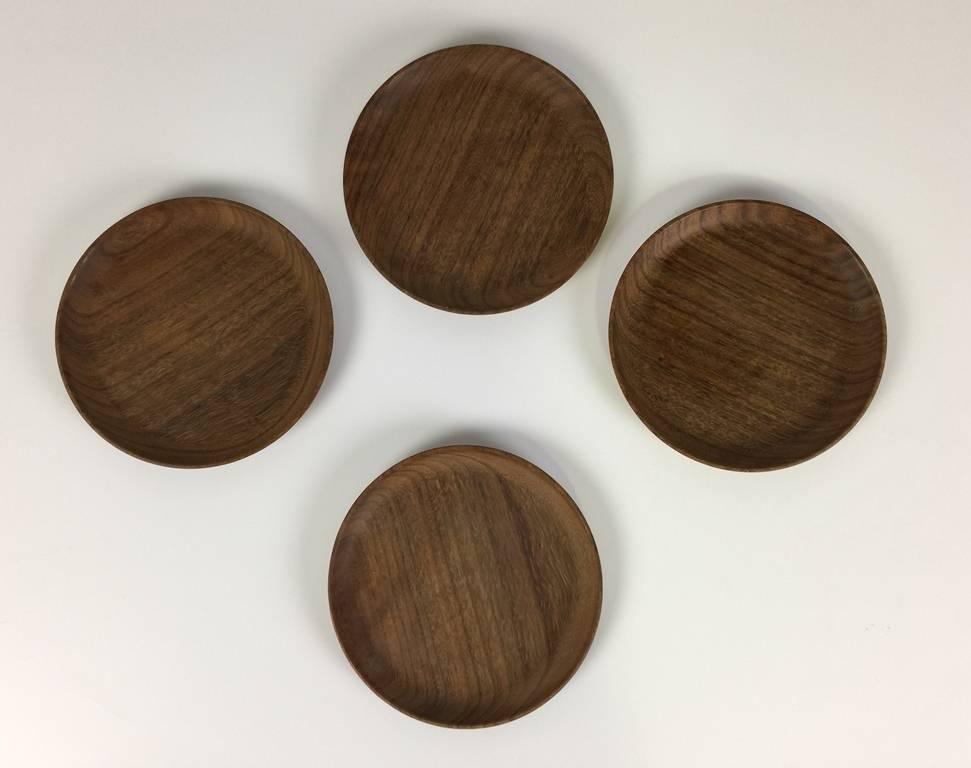 A very handsome, darkly colored set of four plates by American master wood turner Bob Stocksdale. All are signed, dated (1981) and marked (