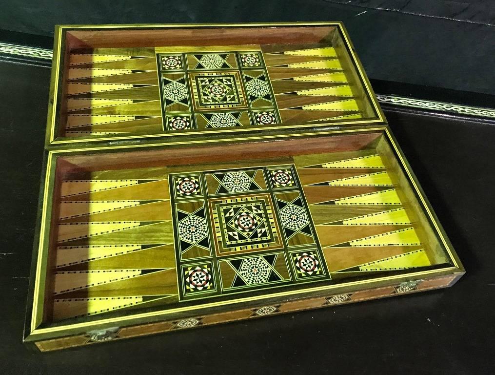 Stunning mosaic design and gorgeous craftsmanship. The board/ box is made of various wood, mother-of-pearl and bone inlays. A genuine work of art. This is for the game board/box only No backgammon or chess pieces included. 

Dimensions: 3.25