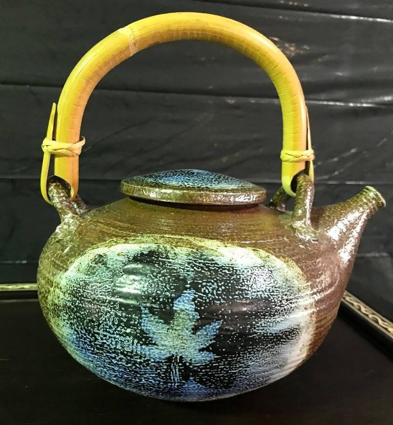 A beautifully executed, wonderfully designed glazed earthenware teapot by ceramics masters husband and wife artists Vivika and Otto Heino. The two were best known for their inspired designs and distinctive glazes. This relatively large teapot is