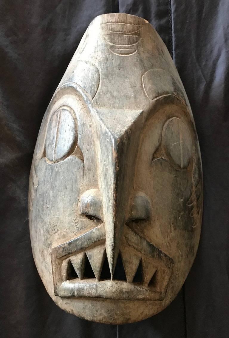 Fantastic Northwest coast dogfish mask - likely Haida. Wonderfully carved and detailed. The dogfish is an important mythic being among the Haida of B.C.'s Queen Charlotte Islands. Would be a great addition to any collection or perfect accent item in