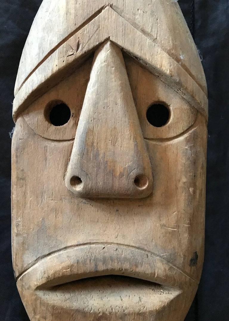 A nicely carved Eskimo (likely either Alutiiq or Sugpiag Native American people of the Kodiak Archipelago). Mask was acquired from a collection that consisted of items purchased from the world famous Rockefeller collection of ethnographic art as