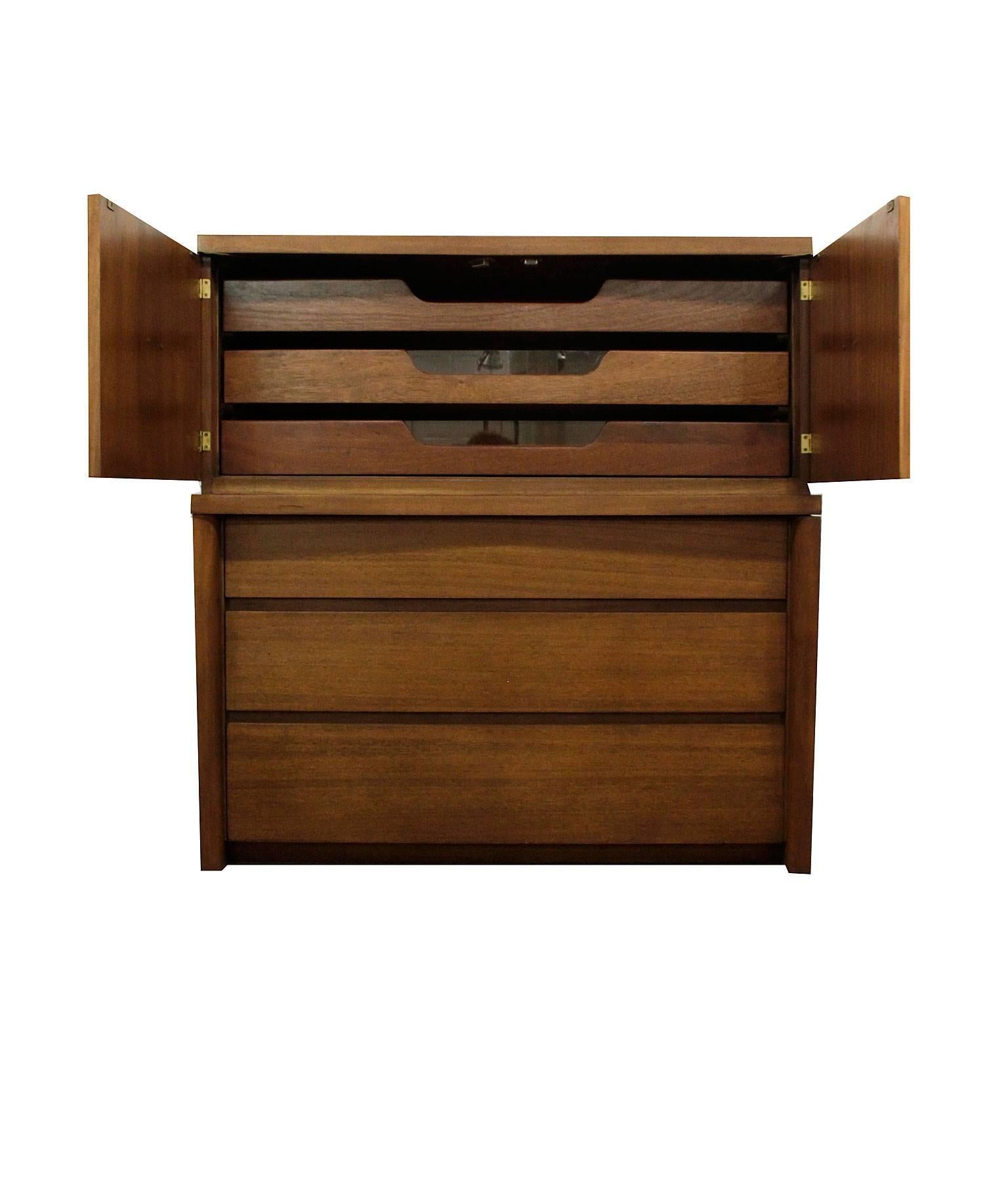 Stunning vintage mahogany high boy dresser by Benson Furniture of Oregon. A perfect blend of Mid-Century Modern and Art Deco elements with outstanding American craftsmanship. The monumental form balanced by smartly styled angles and softened by