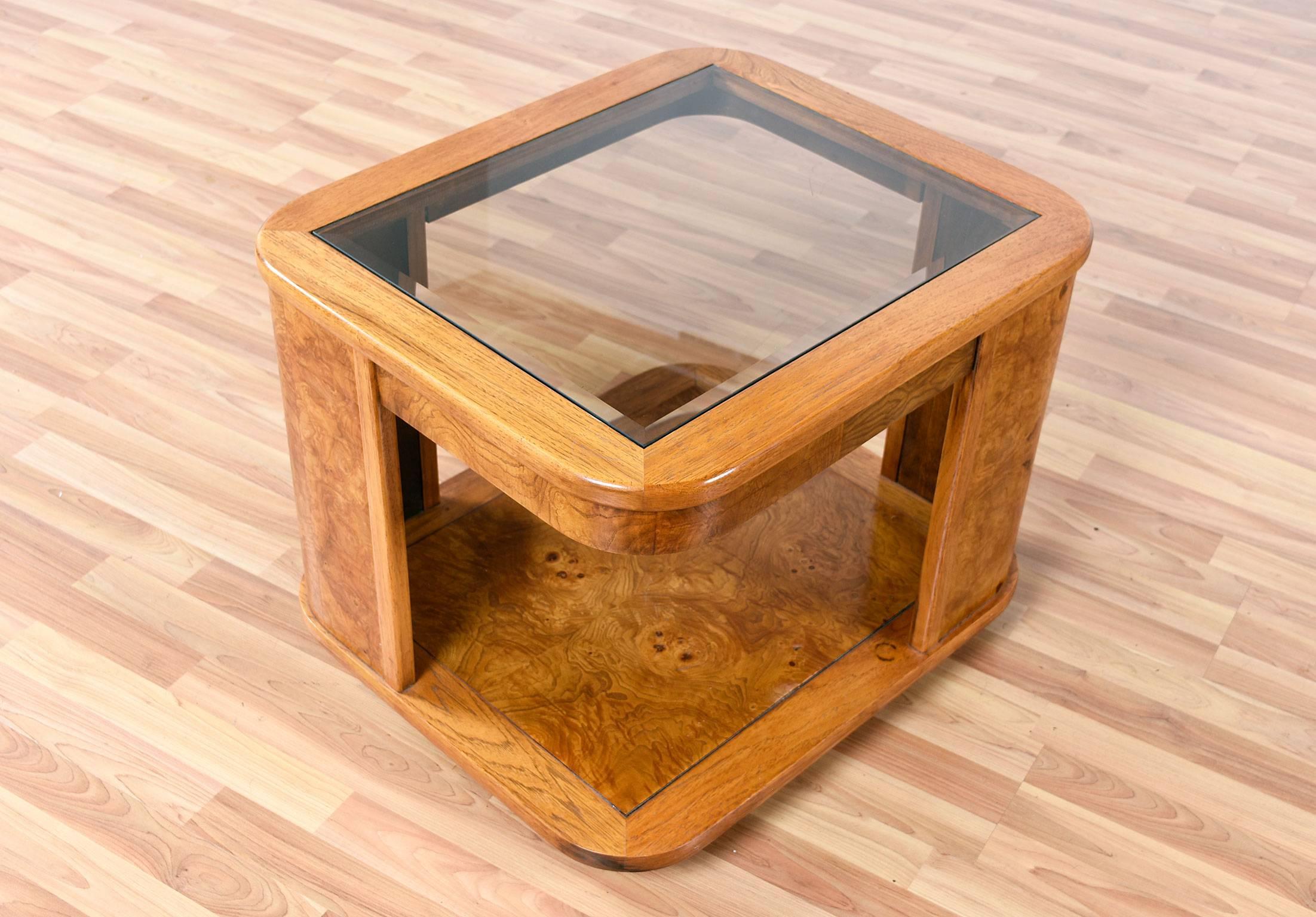 Postmodern burl wood end table with a smoked glass top and storage underneath. The simplified yet elegant contoured lines create a lovely accent piece, while providing plenty of storage space.