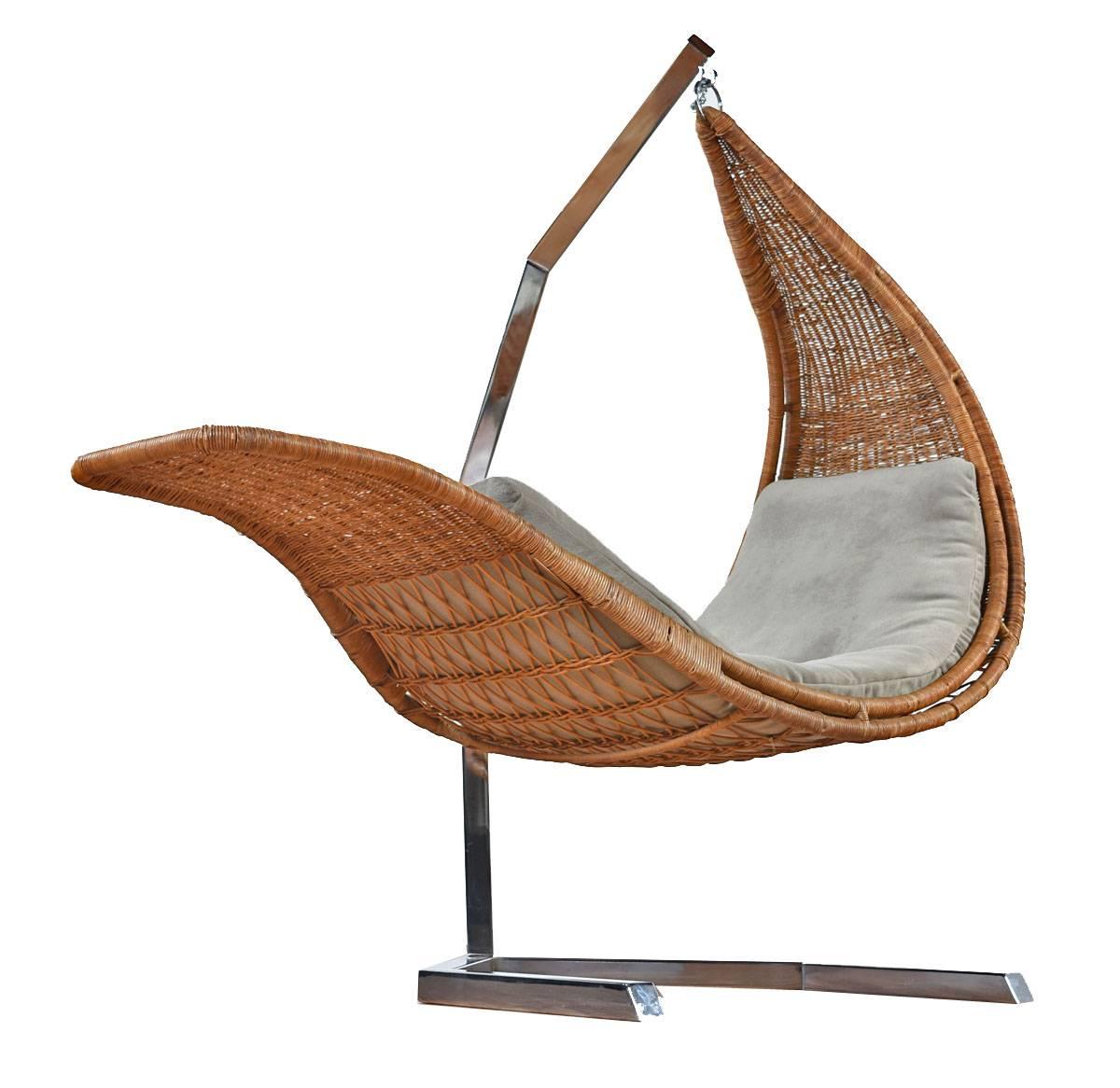 Easily one of the more interesting pieces that we've had the pleasure to present at Furnish Me Vintage. This custom, studio created, wicker chaise longue hangs from a modern chrome steel pillar. The piece is stunning to look at, but also very