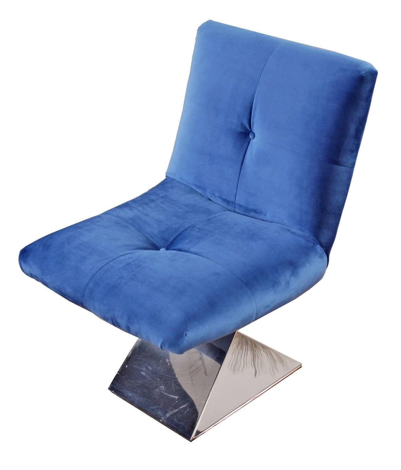 This restored vintage slipper chair in sumptuous blue velvet is an absolute show stopper. The chair has been dissected and rebuilt, removing all of the old foam and worn webbing and installing all new internal materials. The chair was then finished