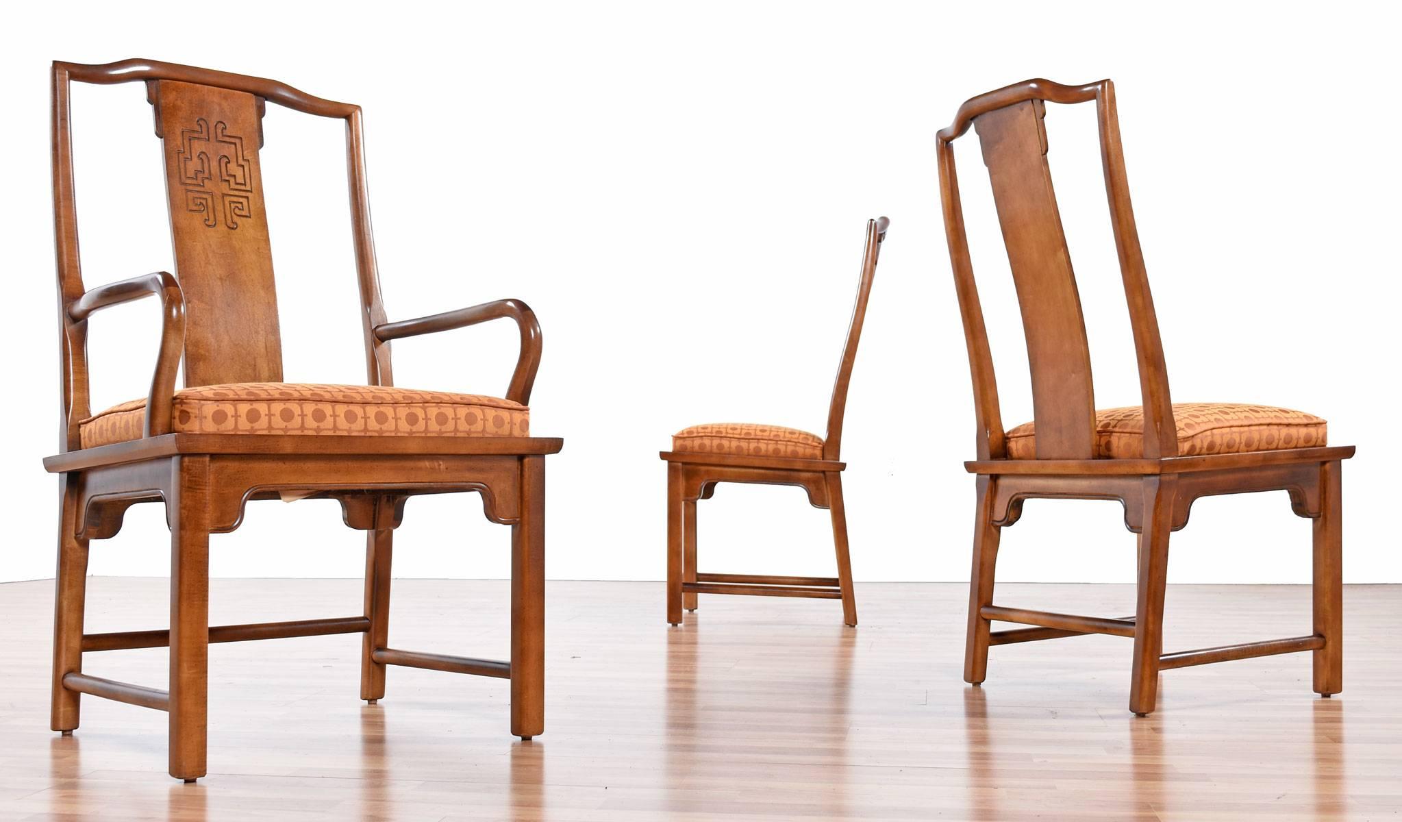 This lovely set of six Chin Hua dining chairs by Raymond K. Sobota for Century Furniture add a modern Asian flair to any dining room. The set includes two arm chairs and four armless chairs, all have a Classic Chinese motif carved into the wood