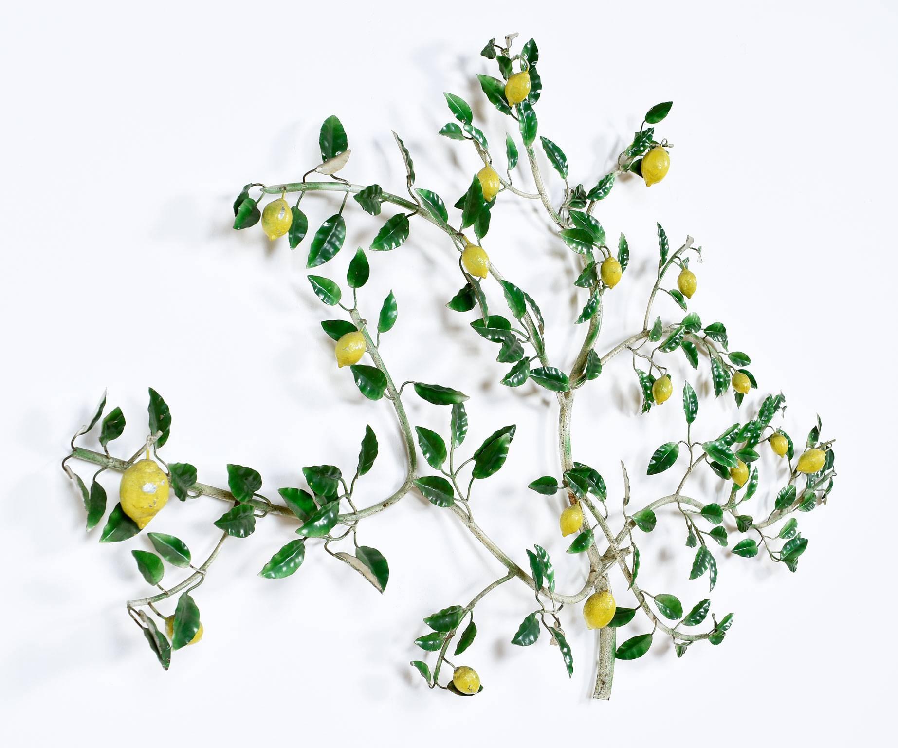 This retro lemon tree tole wall sculpture was made in Italy and is constructed of painted metal. A romantic design with sprawling branches and leaves. More whimsical than the glitzy Curtis Jere pieces of the period. Vintage 1960s, a time when
